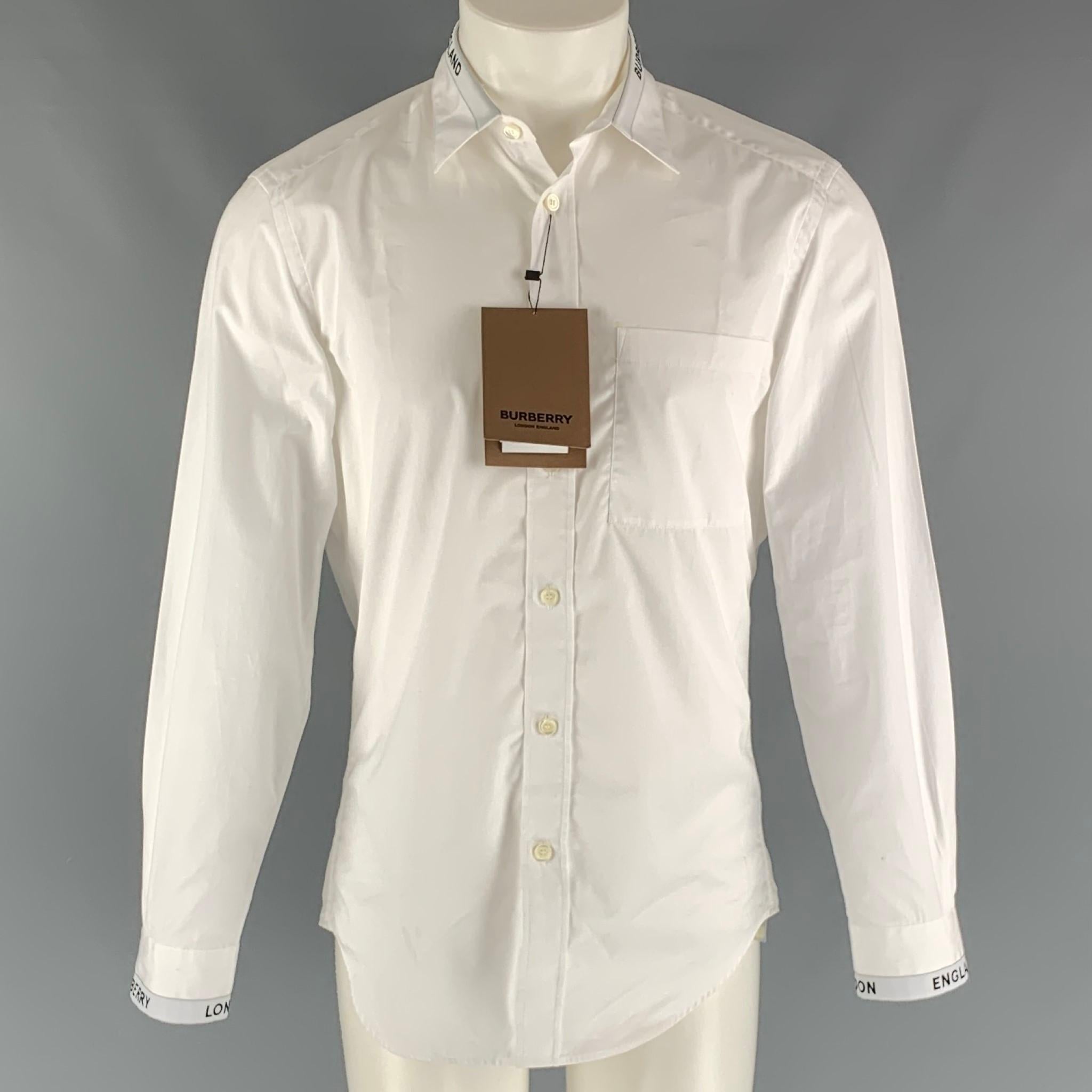 Burberry by Ricardo Tisci long sleeve shirt comes in a white cotton featuring straight collar, Burberry London trim at collar and sleeve cuffs, and buttons closure. Made in Portugal.

Very Good Pre-Owned Condition. With Tags. Moderate marks.
Marked: