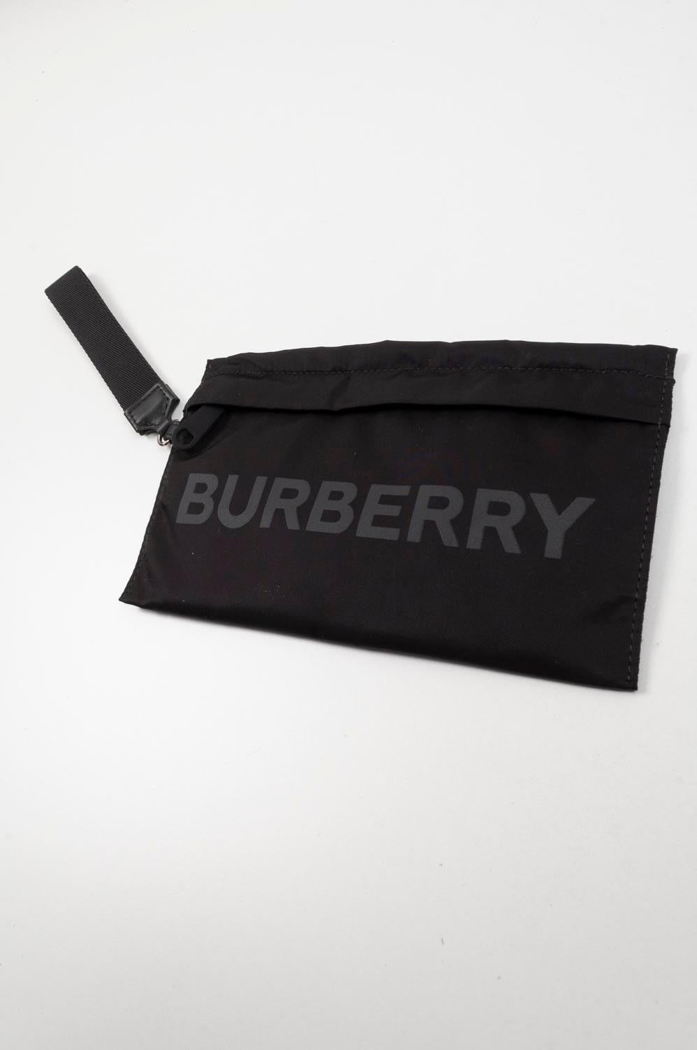 Item for sale is 100% genuine Burberry Women Men Handbag, S323
Color: Black
(An actual color may a bit vary due to individual computer screen interpretation)
Material: Cloth
Tag size: One Size
This bag is great quality item. Rate 10 of 10, New with