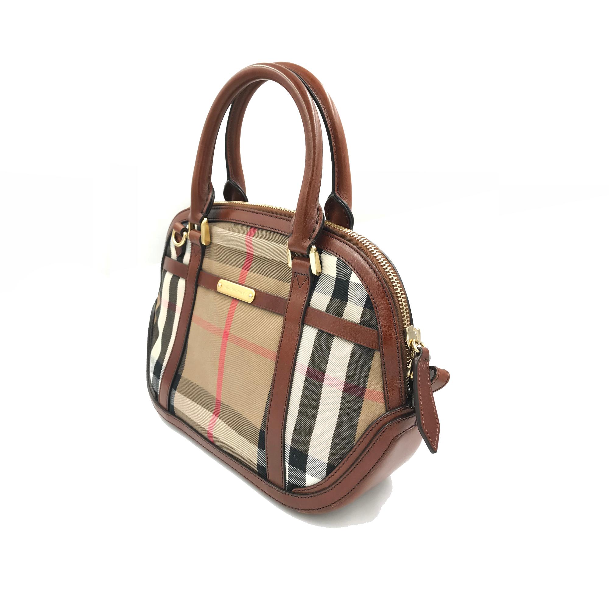 Brown leather and cotton cotton 'Orchard' tote from Burberry featuring a nude and black Haymarket check body. a gold-tone zip up fastening, two short rounded handles to the top, a detachable shoulder strap, a padlock charm detail to the front and a