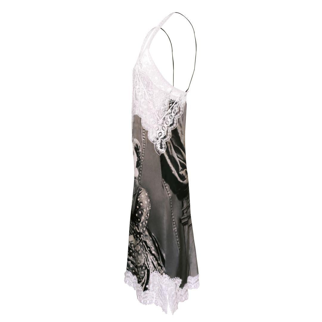 Unique lace detail black and white Victorian portrait print silk slip dress as featured in the Spring/Summer 2019 runway collection.

Straight and slinky silhouette with a low cut, deep V neckline featuring Italian lace inset and trimmed hem. Mini