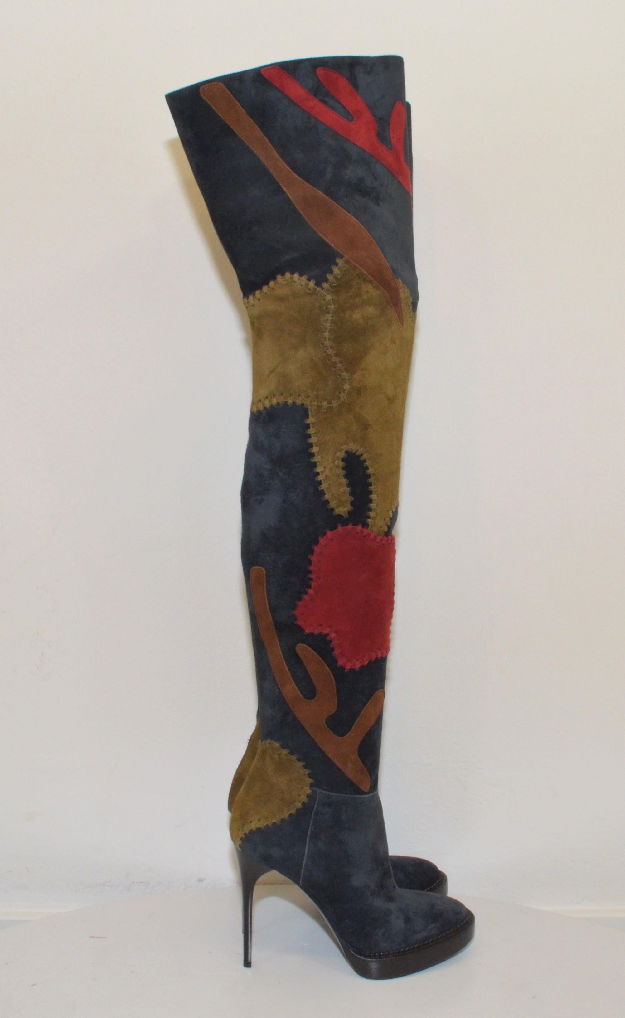 Burberry thigh-high boots in suede with a patchwork design and side zipper fastenings. Leather insoles and soles, size 37, made in Italy. Boots are in great condition with minimal wears to the soles. 

Heel height 4.5''
Shaft 24''