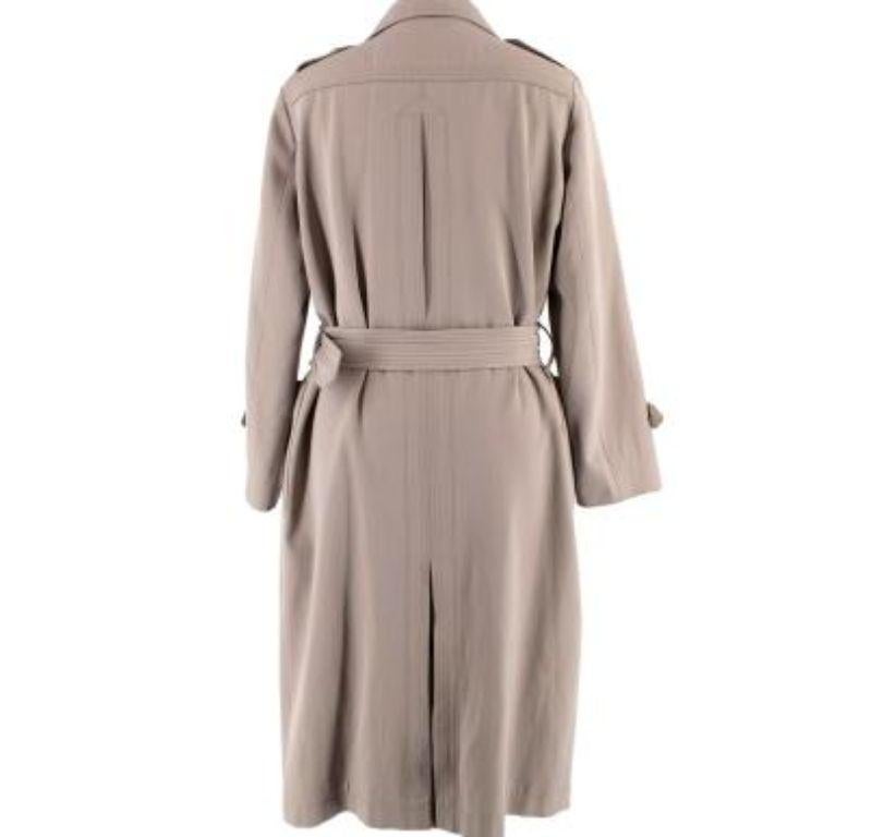 Burberry Taupe Wool-Blend Trench Coat

- Wool and cotton blend taupe double-breasted trench coat with belt 
- 2 large side patch pockets 
- Black leather belt buckle 
- Partially satin lined 
- Button trim on the sleeve cuffs and shoulders 
-