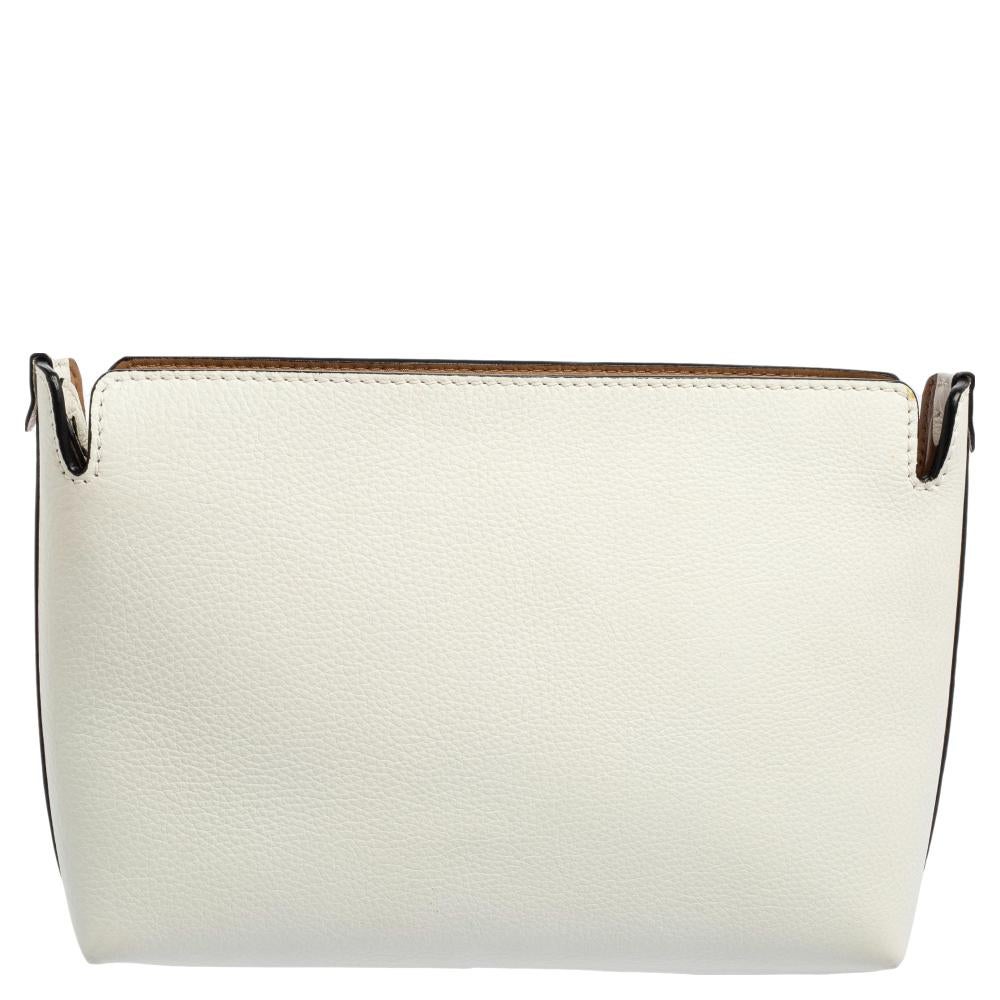 The clutch from the house of Burberry is a timeless collectible! It is crafted in leather and features a silver-tone zip closure that opens into a large leather-lined interior. Carry this to your next gala and expect a trail of