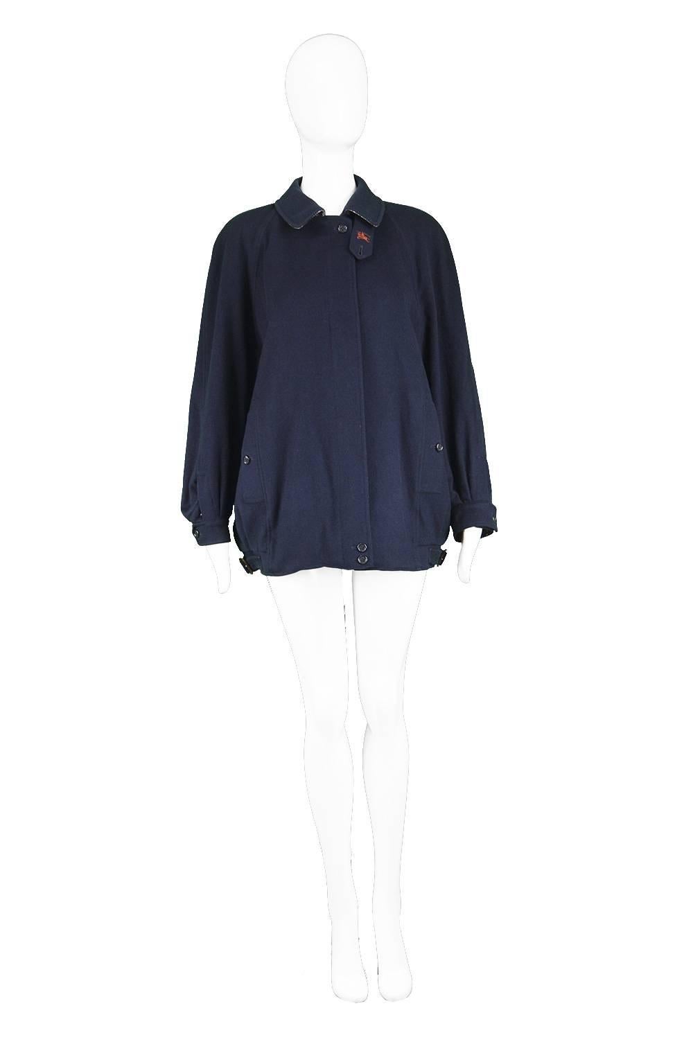 Burberry Vintage 1980s Navy Blue Alpaca & Wool Embroidered Women's Bomber Jacket

Estimated Size: Women's Medium to Large but this gives an intentionally oversized fit. Please check measurements. 
Bust - 48” / 122cm (meant to have a loose fit)
Waist