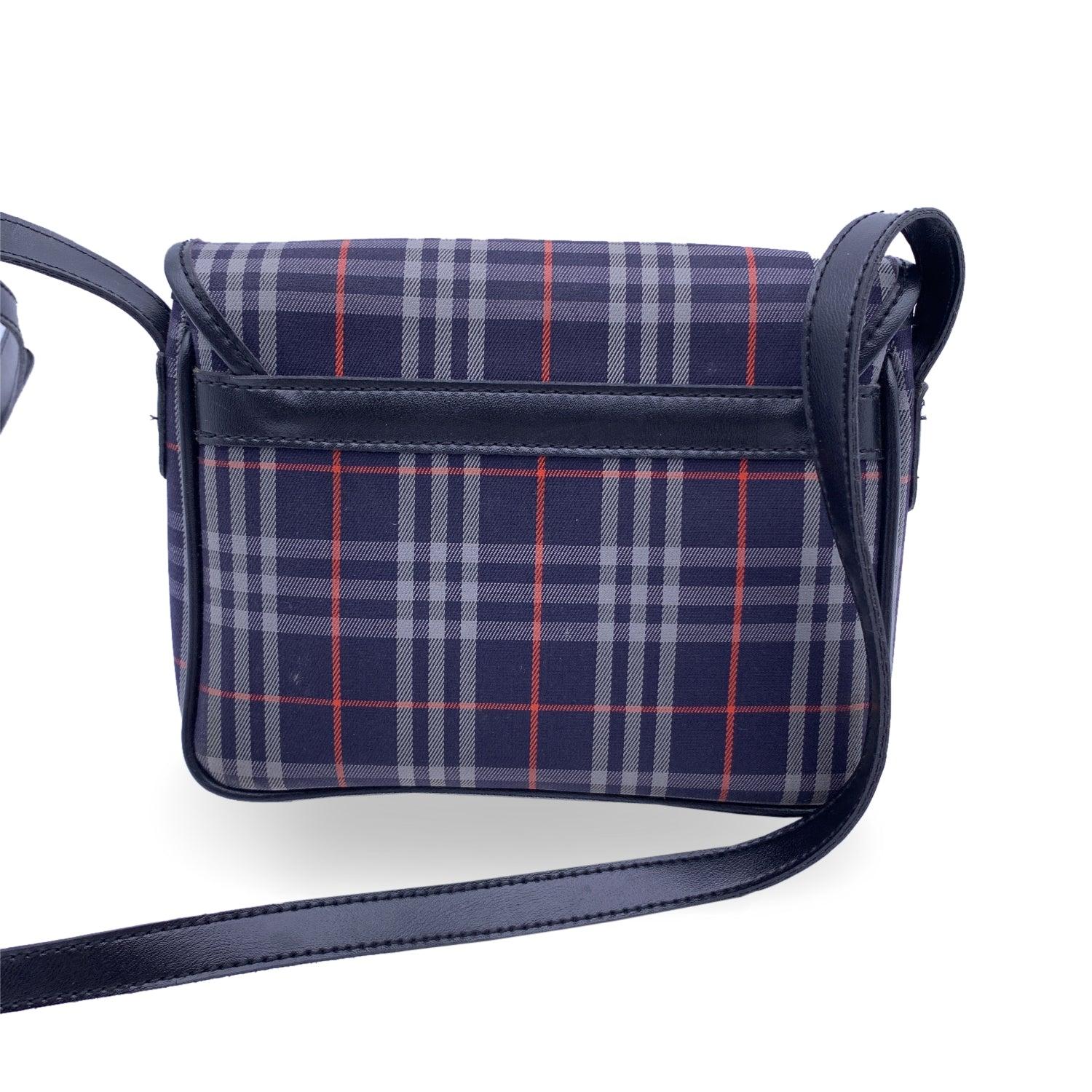 This beautiful Bag will come with a Certificate of Authenticity provided by Entrupy. The certificate will be provided at no further cost Burberry Messenger bg in iconic nova check plaid canvas in blue color with blue leather trim and adjustable