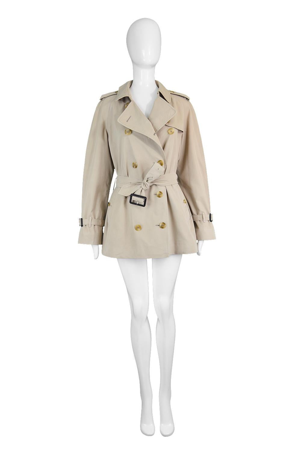 Burberry Vintage Women's Beige Gabardine Double Breasted Mac Rain Trench Coat, 1980s

Estimated Modern Size: UK 14-16/ US 10-12/ EU 42-44. Please check measurements & description by clicking 'Continue Reading' below. 
Bust - 42” / 106cm (allow