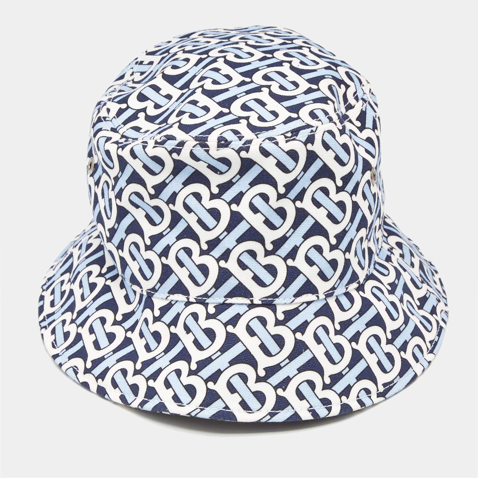 The Burberry bucket hat combines style and comfort featuring a classic design adorned with the iconic TB monogram. Crafted from soft cotton it offers a lightweight feel perfect for sunny days. The contrasting colors create a fresh look making it an