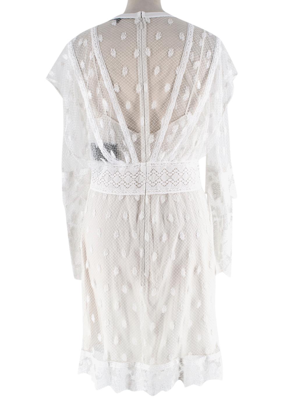 Burberry White Lace Overlay Dress

- Delicate white lace overlay with dotted detailing 
- Detachable nude silk underslip 
- Midi length 
- Full sleeves 
- Eyelash edging 
- Ribbed round neckline 
- Back zip fastening

Materials: 
Main - 100%