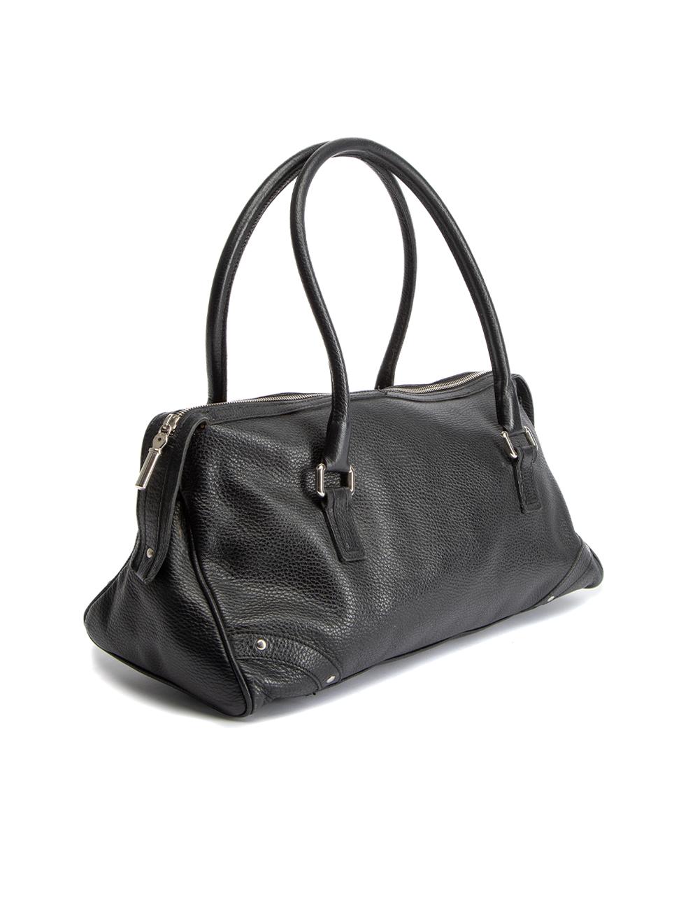 CONDITION is Good. Minor wear to bag is evident. Light wear to the leather exterior where there are used corners and finishing missing to the bag handles. There is also natural folding to the bag from use, and wear to the inner lining. A dark stain
