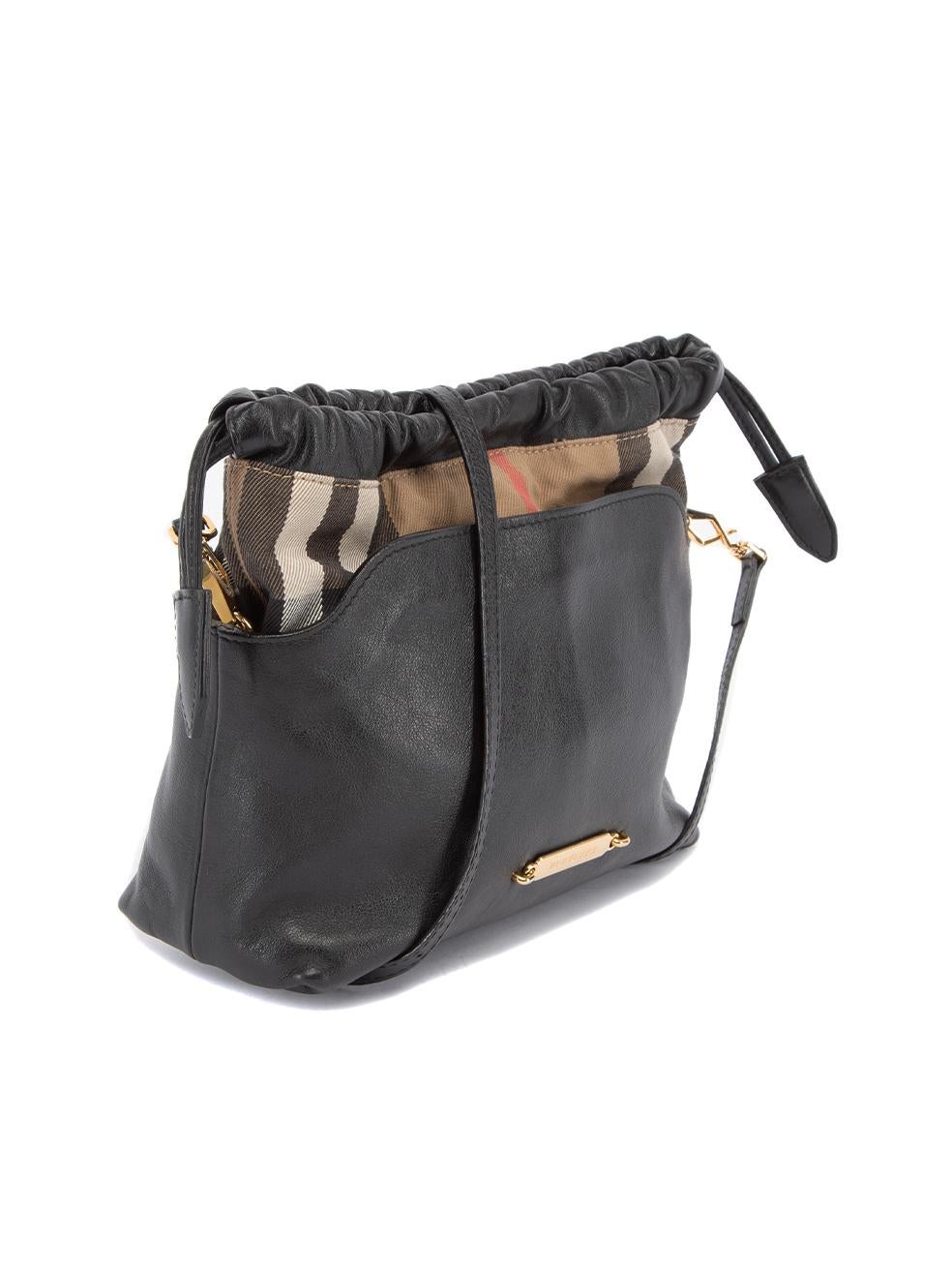 CONDITION is Very good. Minimal wear to bag is evident. Minimal wear to the leather material and some light scuffs at the bag corners on this used Burberry designer resale item. 
 
 Details
  Black
 Leather
 Mini crossbody bag
 House check panelled
