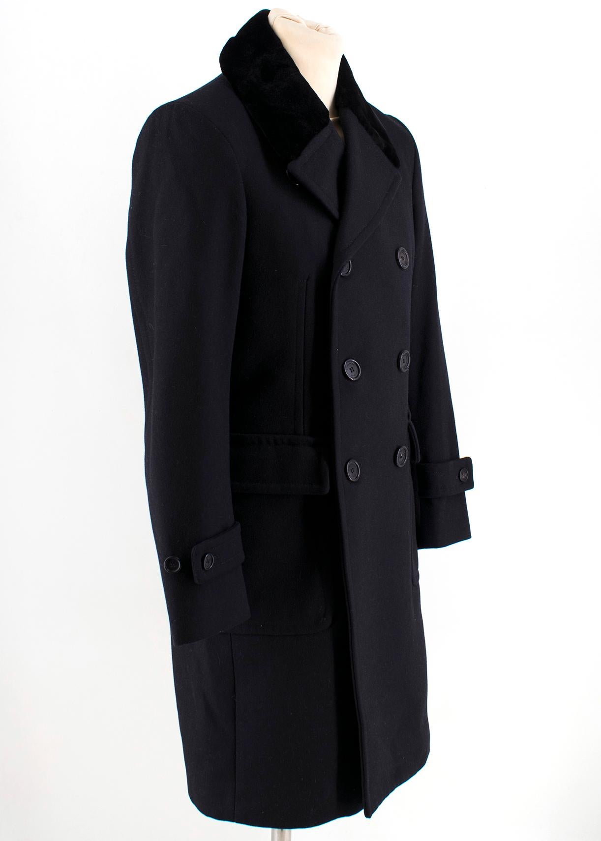 Burberry Wool Black Tailored Coat with Mink Fur Collar

Tailored long coat with a soft fur collar, 
Long sleeves, 
Front centre button fastenings, 
Two front flap pockets,
Back button-through vent,
Rear belt with button fastenings,
Mid-weight
80%
