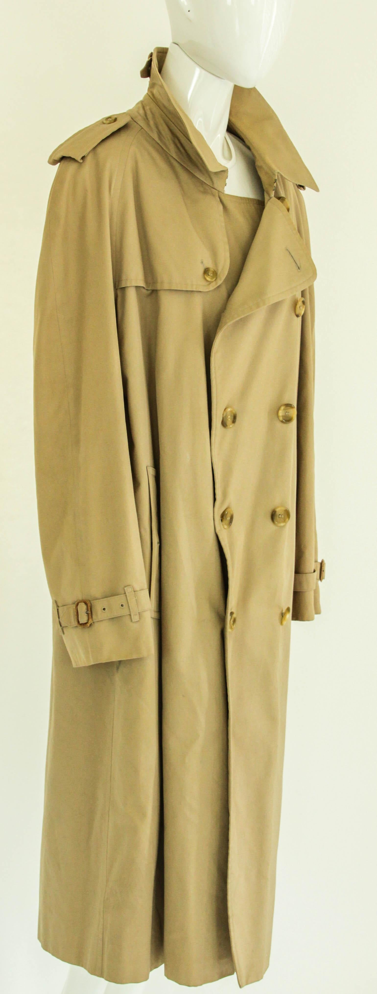 Burberry Classic Double Breasted Trench.
BURBERRY'S London Mens Belted Trench Coat Tan marked regular Size 48.
Burberry's trench coat, vintage coat, classic, tan gabardine trench dating to the 1980's. 
An excellent vintage men's trench coat