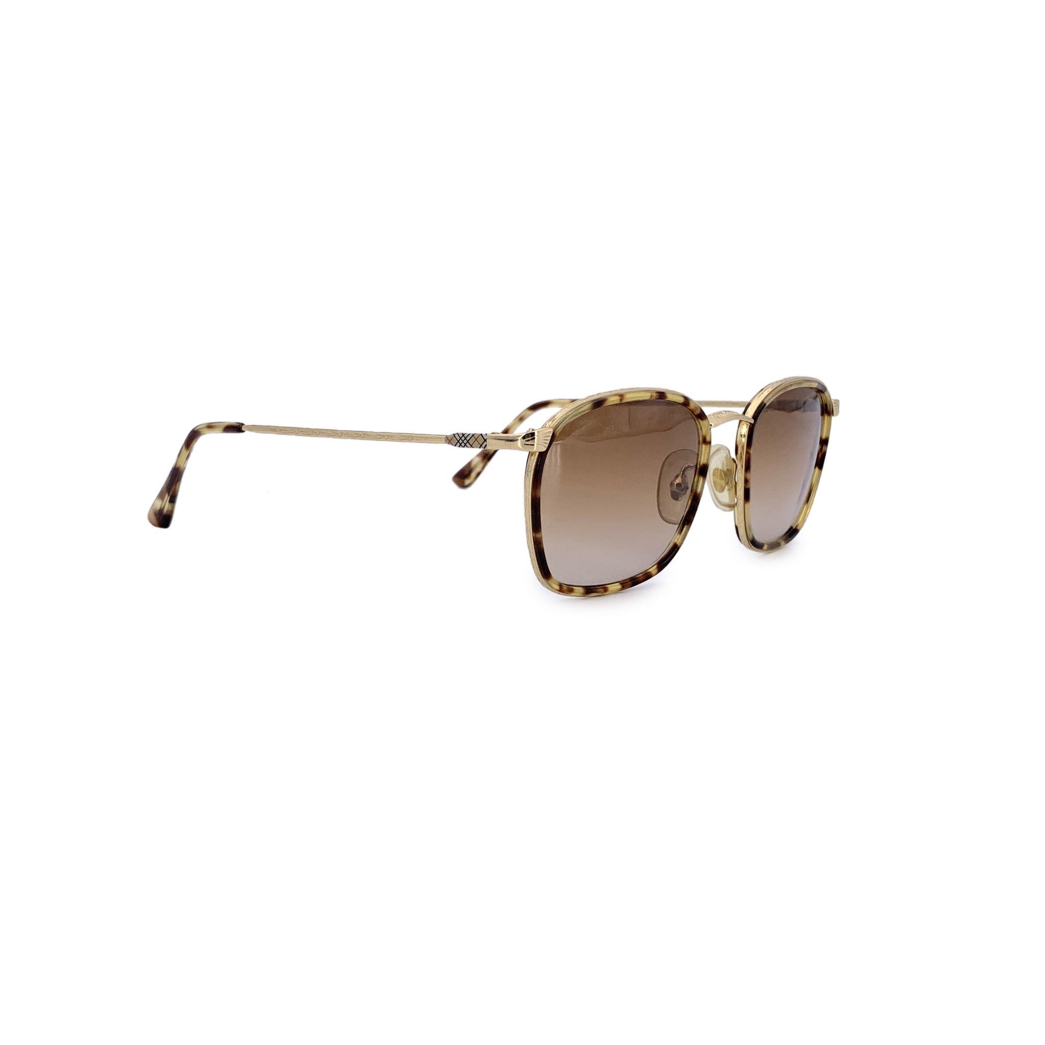 Step into timeless British elegance with these Burberrys of London B47 sunglasses - a rare vintage treasure for lovers of classic design and refined details. This standout model features a sleek gold metal frame, delicately bordered with rich Havana