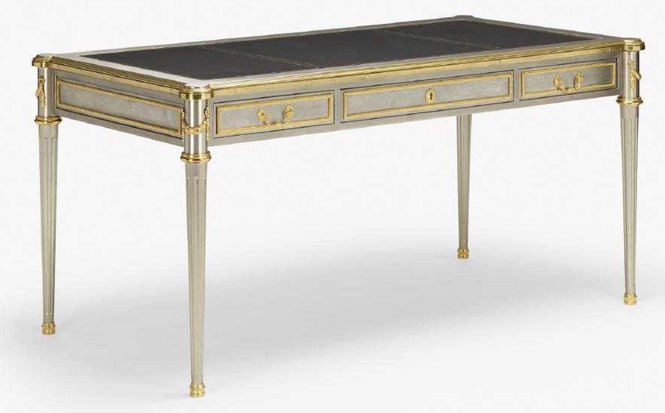 Bureau Plat by John Vesey (1924 – 1992)
Bureau Plat, stainless steel, brass, and leather writing desk in the neoclassical style with three frieze drawers to one side. The center drawer measures 24
