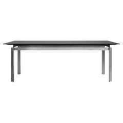 Table rectangulaire Buredo à plateau en verre noir et pieds chromés 