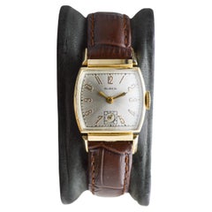 Montre Art Déco à cornes articulées en or de Buren des années 1940