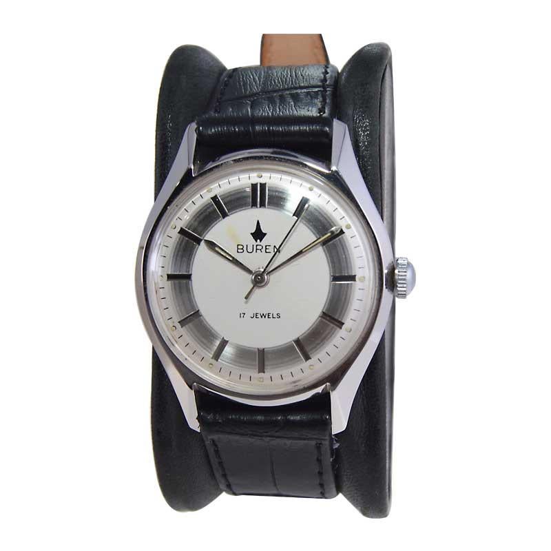 FACTORY / HOUSE: Buren Watch Company 
STYLE / REFERENCE: Round 
METAL / MATERIAL: Steel 
CIRCA / YEAR: 1960's
DIMENSIONS / SIZE: Length 41mm X Diameter 34mm
MOVEMENT / CALIBER: Manual Winding / 17 Jewels 
DIAL / HANDS: Original Two Tone with Baton