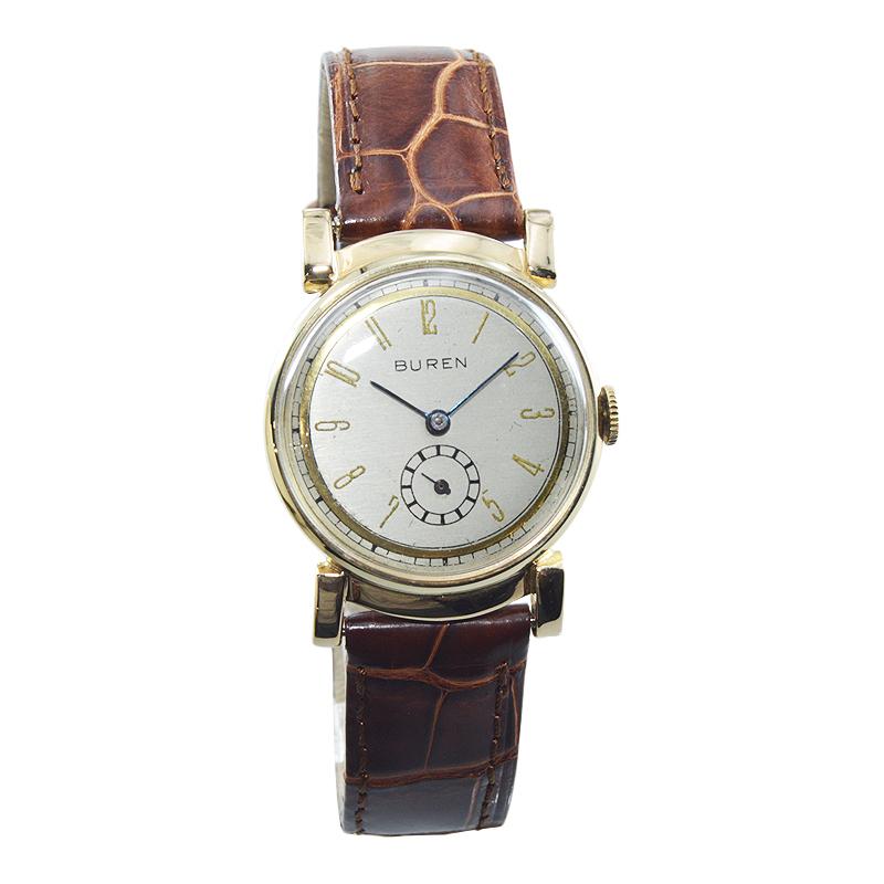 FACTORY / HOUSE: Buren Watch Company
STYLE / REFERENCE: Round Dress Model
METAL / MATERIAL: 14Kt. Solid Gold
CIRCA / YEAR: 1940's 
DIMENSIONS / SIZE: Length 37mm X Diameter 29mm
MOVEMENT / CALIBER: Manual Winding / 17 Jewels 
DIAL / HANDS: Original