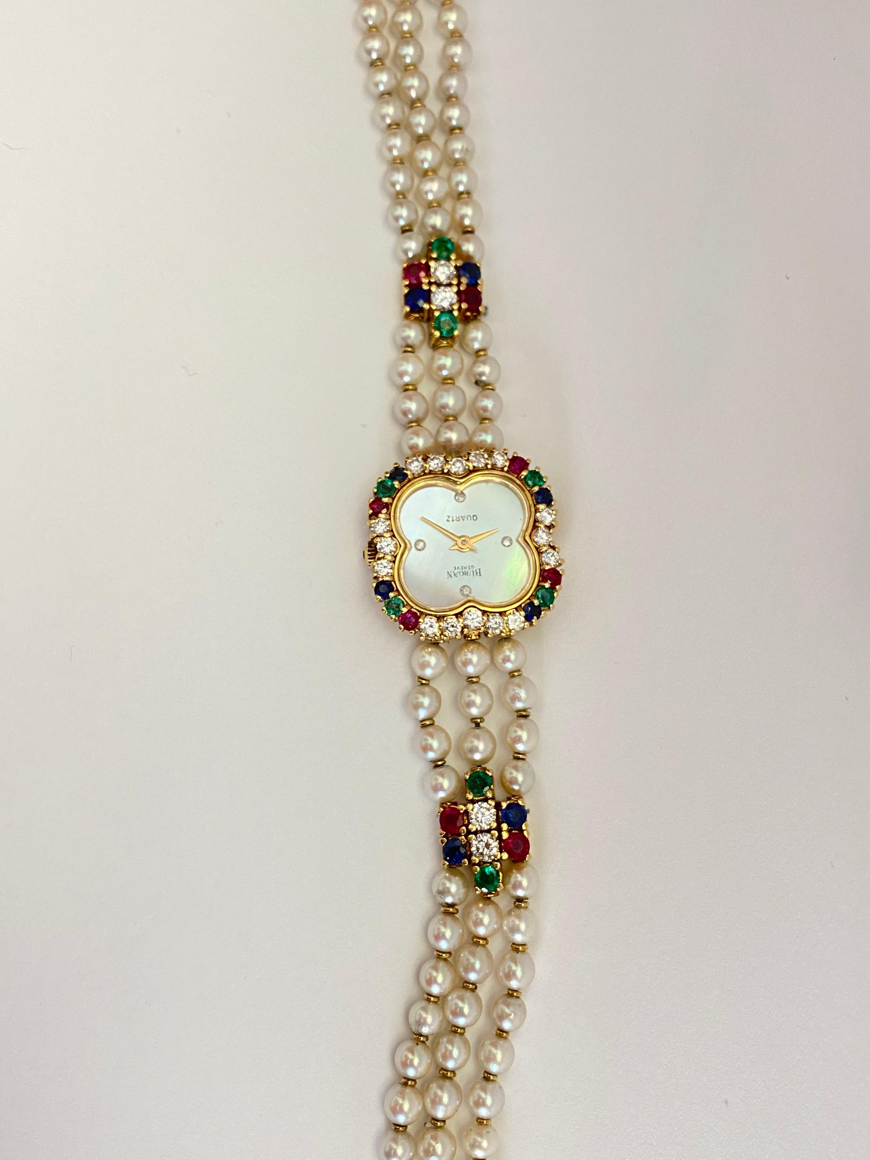 Burgan Genève women's  Vintage Quartz made watch. 
The dial is 18K Yellow Gold made with 16 Round Brilliant Cut Diamonds 4 Natural round cut Rubies, 4 Natural round cut Sapphires & 4 Natural round cut Green Emeralds.  
The pear bracelet also