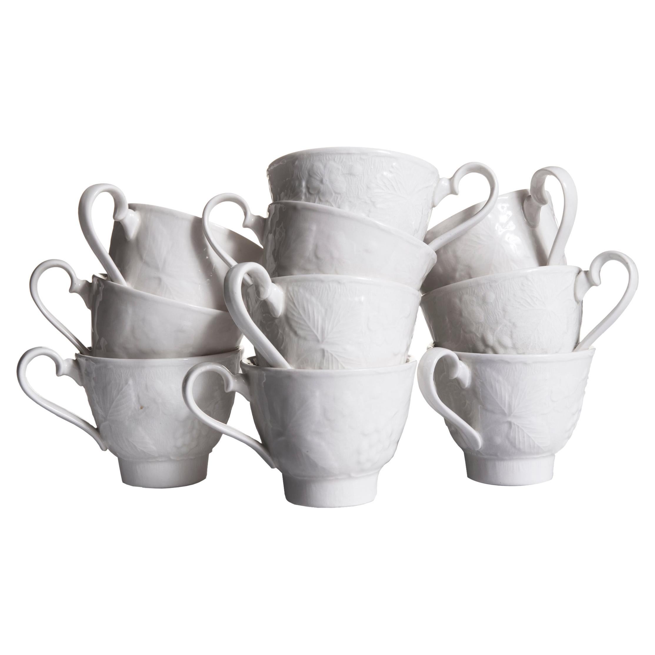 Burgess & Leigh English Ironstone teacups & saucers in the Davenport pattern with embossed strawberry and grape leaf design.
Set of 10.
Cups; 3.5