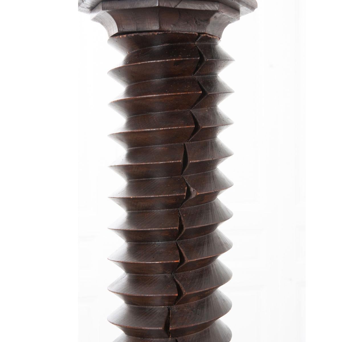 This wonderfully aged 19th century grape press screw - from a winery in Burgundy, France - has been converted into a pedestal with an octagonal top and base added later. The shaft would have driven a large stone wheel downward, crushing and