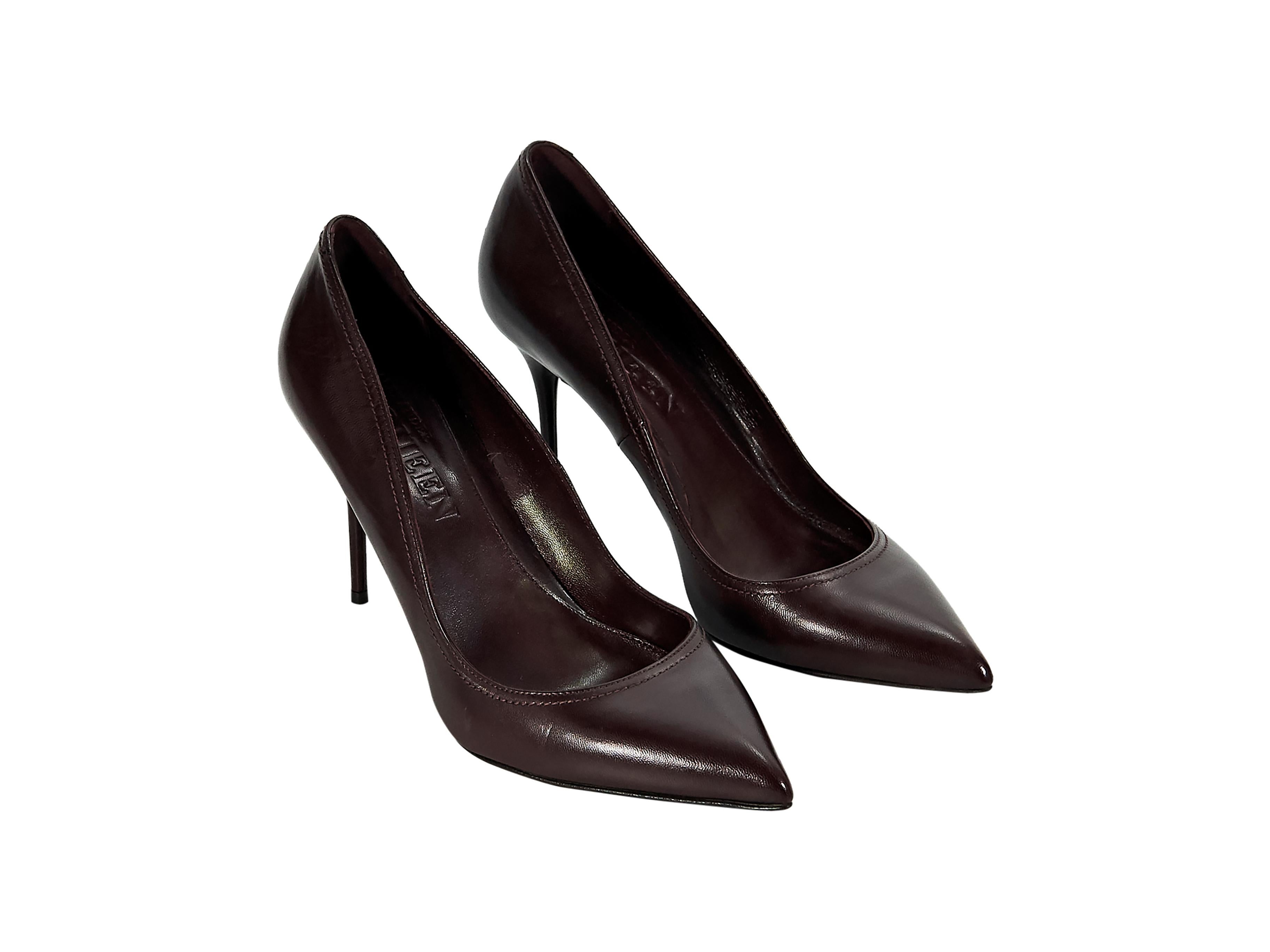 Product details:  Burgundy leather pumps by Alexander McQueen.  Point toe.  Slip-on style.  3.5