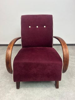 Burgundy armchair by Jindřich Halabala