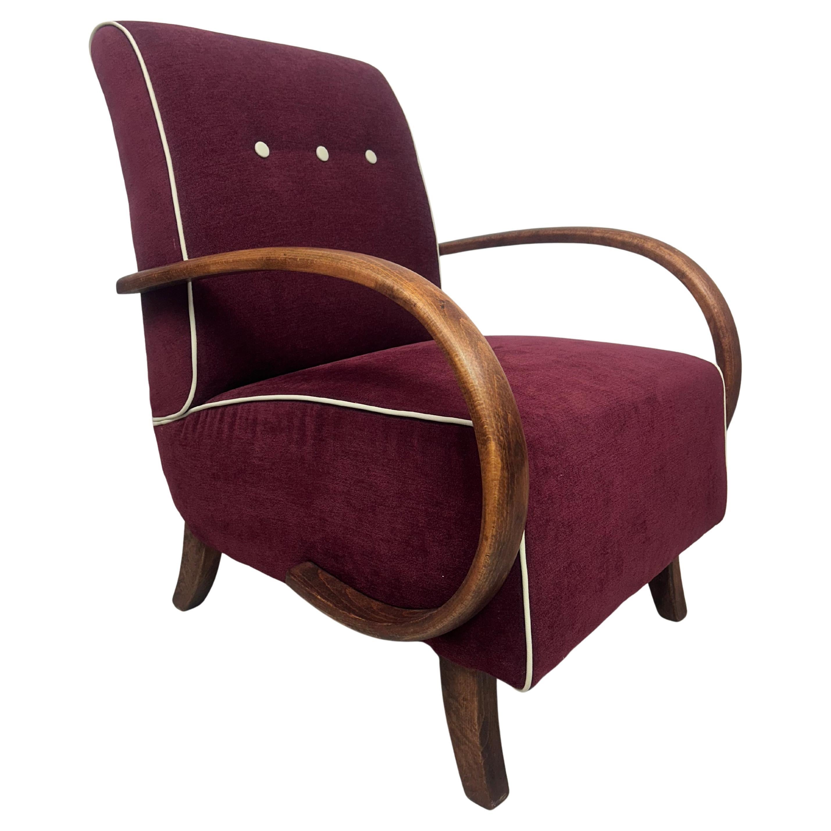 Burgundy armchair by Jindřich Halabala