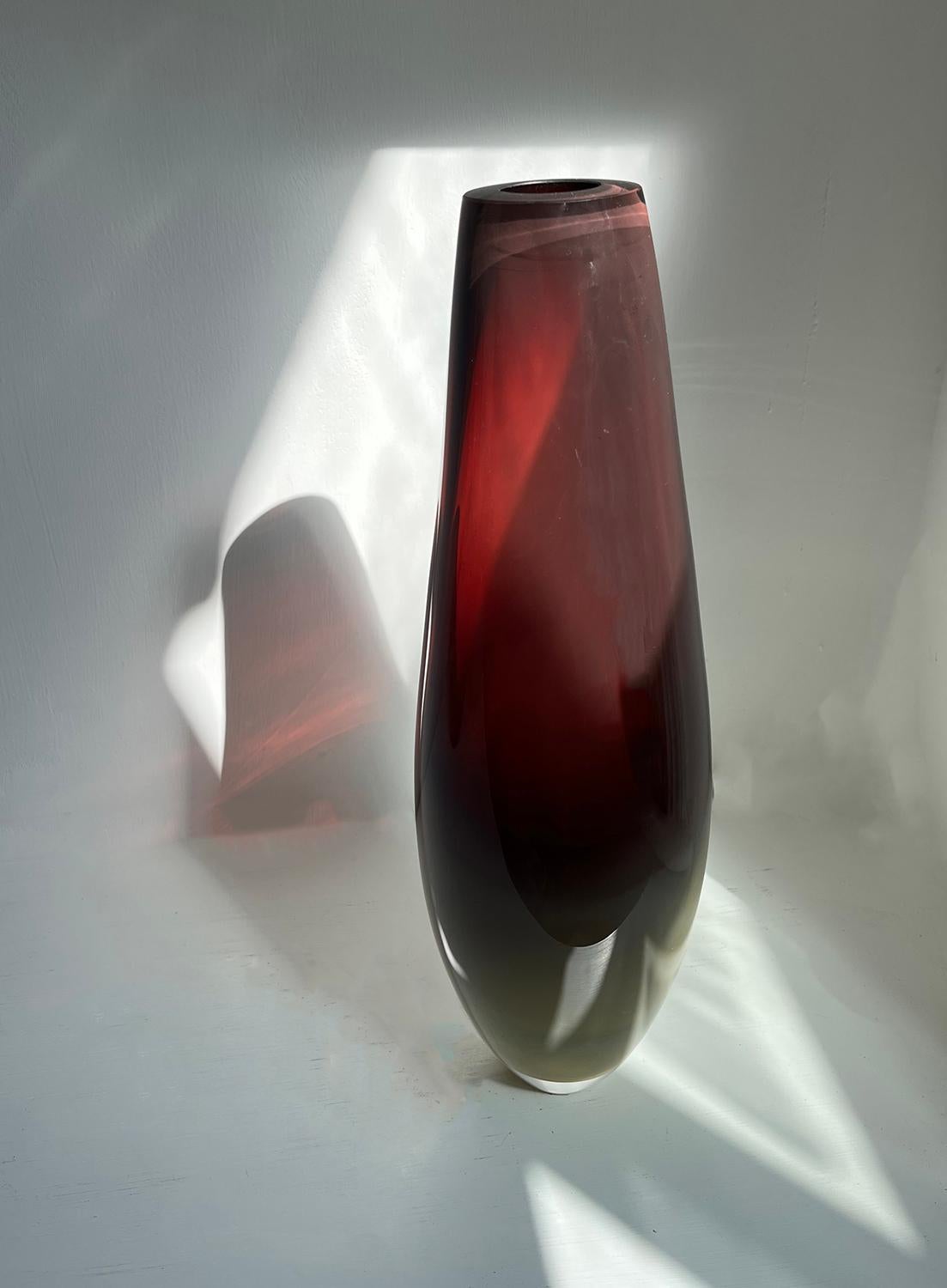 Tall burgundy cut rim bullet style vessel.
Burgundy deep red coloured glass merges into mustard ochre base. 
Unique, hand made, one of a kind.