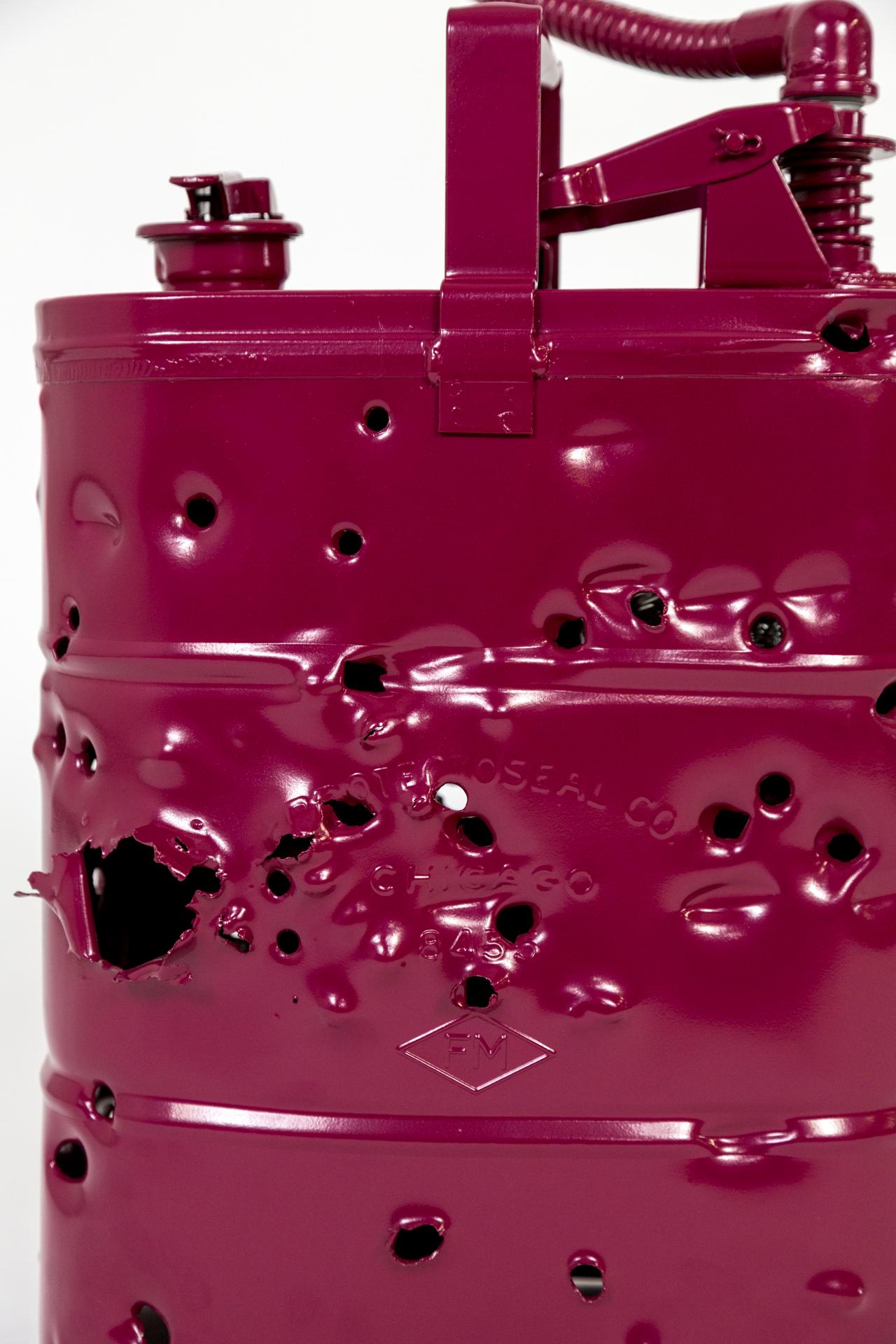 This antique metal gas can was shot with bullets, powder coated and wired as a lamp to become a bold work of art made Charles Linder. He has been making artwork out of bullet-riddled objects for over 30 years. The light coming through the holes has