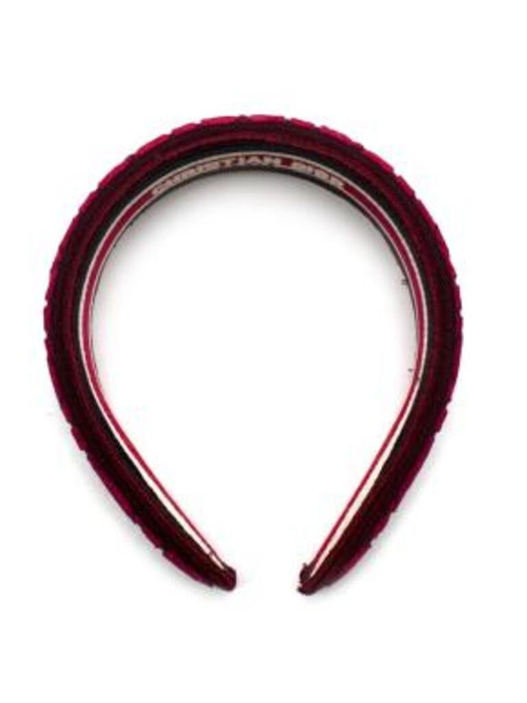 Dior burgundy Cannage velvet headband
 

 - Soft velvet body
 - Embroidered Cannage stitching 
 - Curved body 
 - Lined with an embroidered cotton Christian Dior logo 
 

 Materials:
 Cotton
 Velvet
 

 PLEASE NOTE, THESE ITEMS ARE PRE-OWNED AND MAY