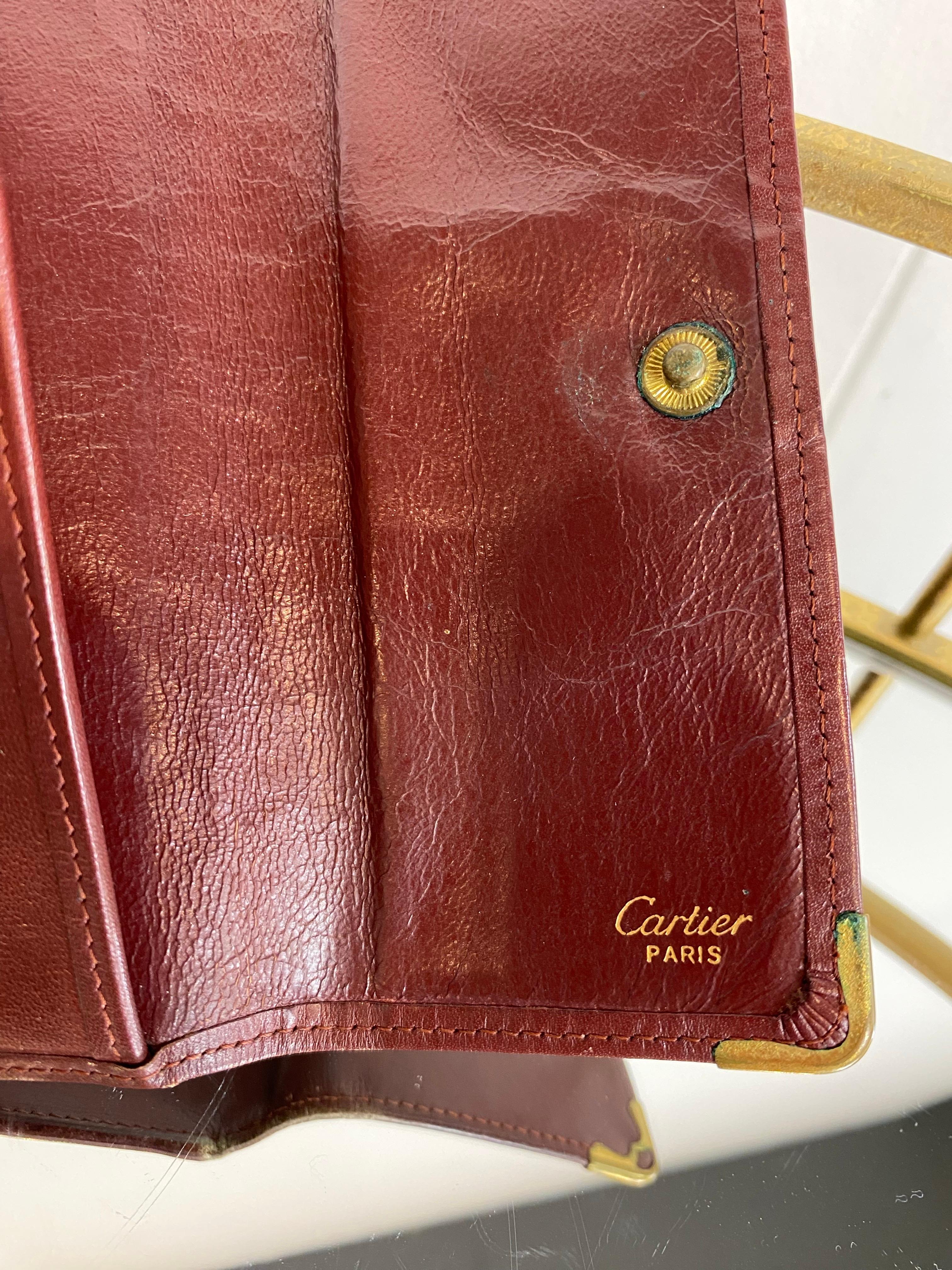 Brown Burgundy Cartier wallet. For Sale