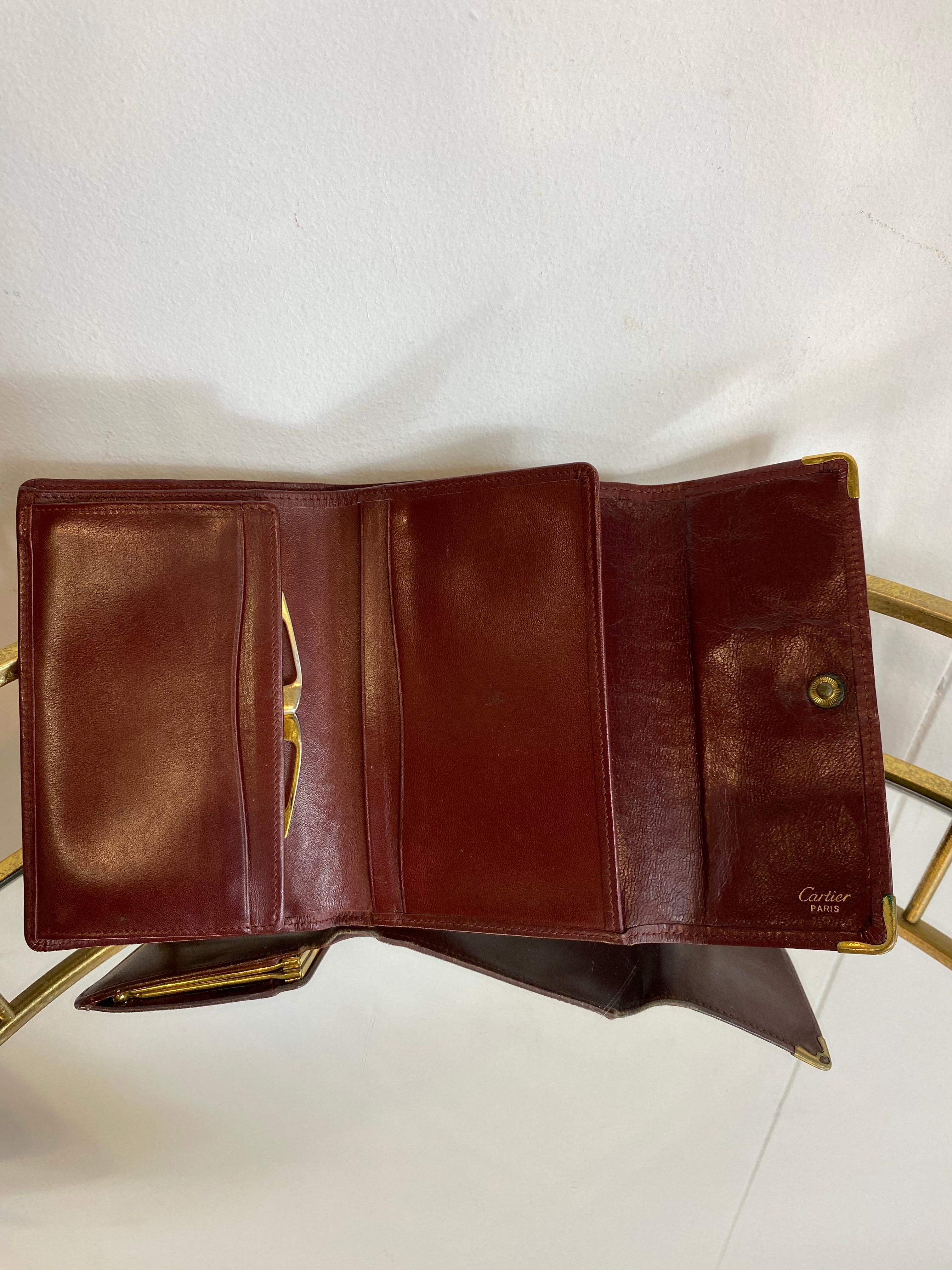 Women's or Men's Burgundy Cartier wallet. For Sale