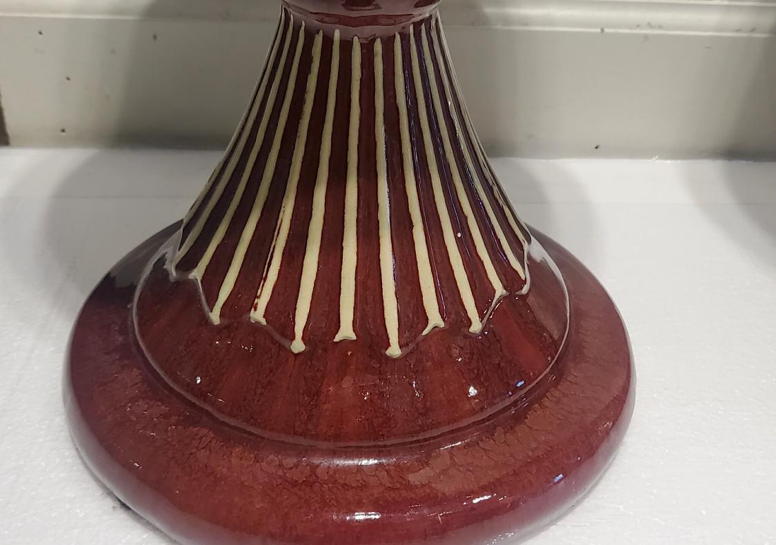 Burgundy ceramic vases.