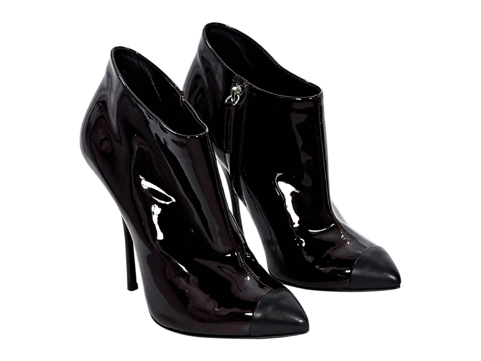 Product details:  Dark burgundy patent leather ankle boots by Giuseppe Zanotti.  Point cap toe.  Inner zip closure. 
Condition: Pre-owned. Very good. 
Est. Retail $1,095