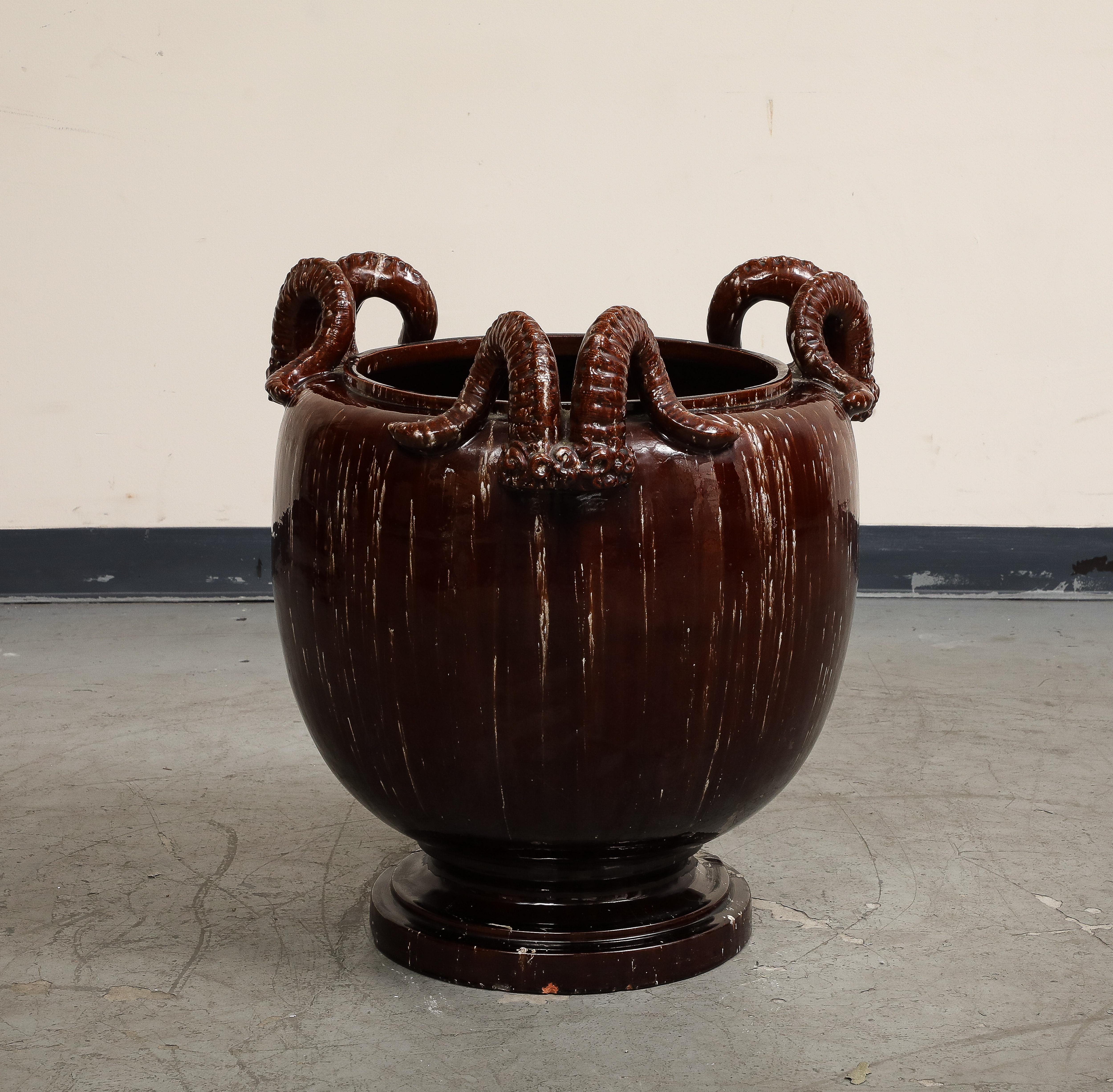 Asian Burgundy Glazed Chinese Pottery Jardiniere with Ram's Horns For Sale