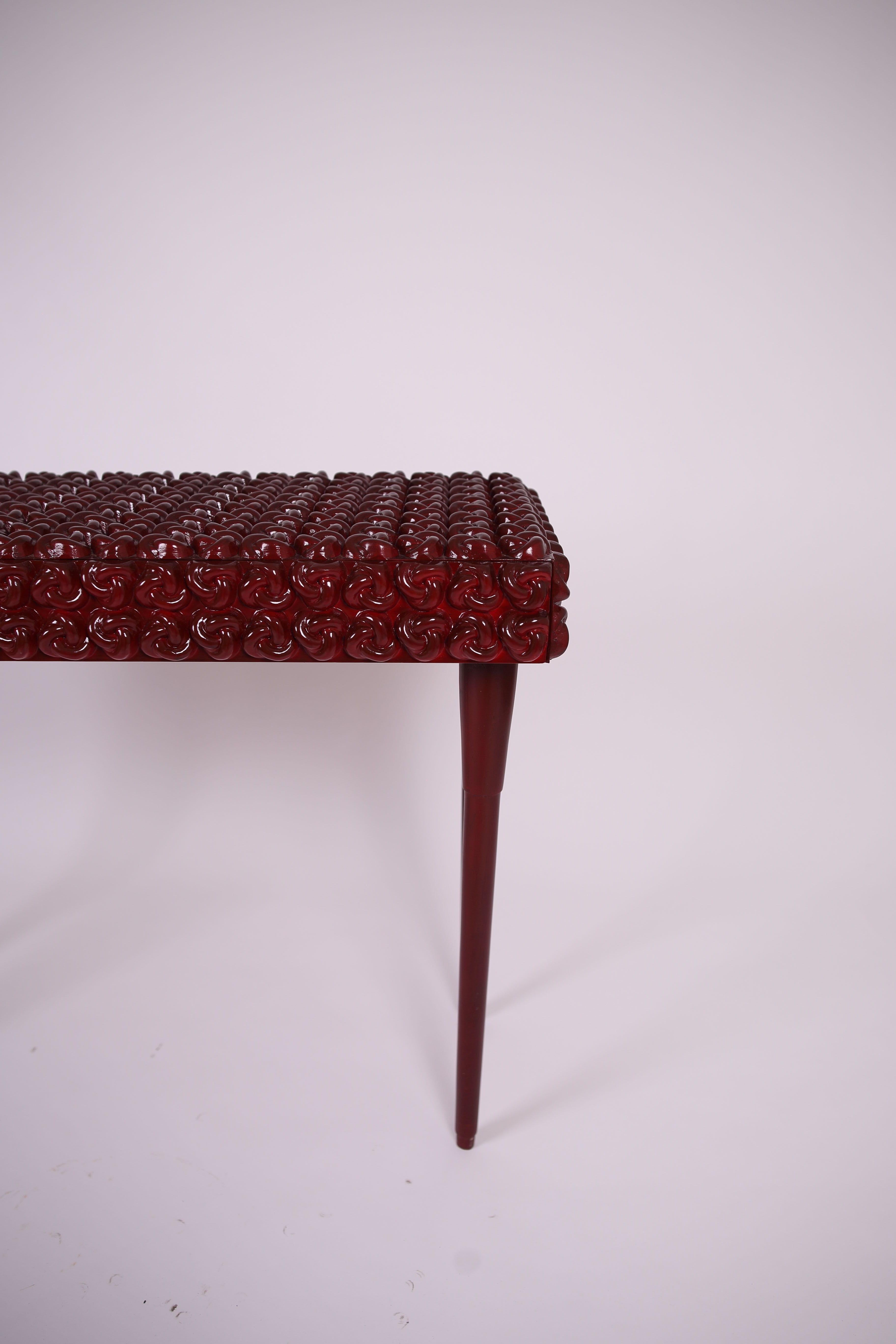 Introducing the Burgundy Handcrafted Console Table, a luxurious addition to your home decor that combines the elegance of solid ash wood with an intricate carved knot design. This artisan console table is meticulously crafted, featuring rich
