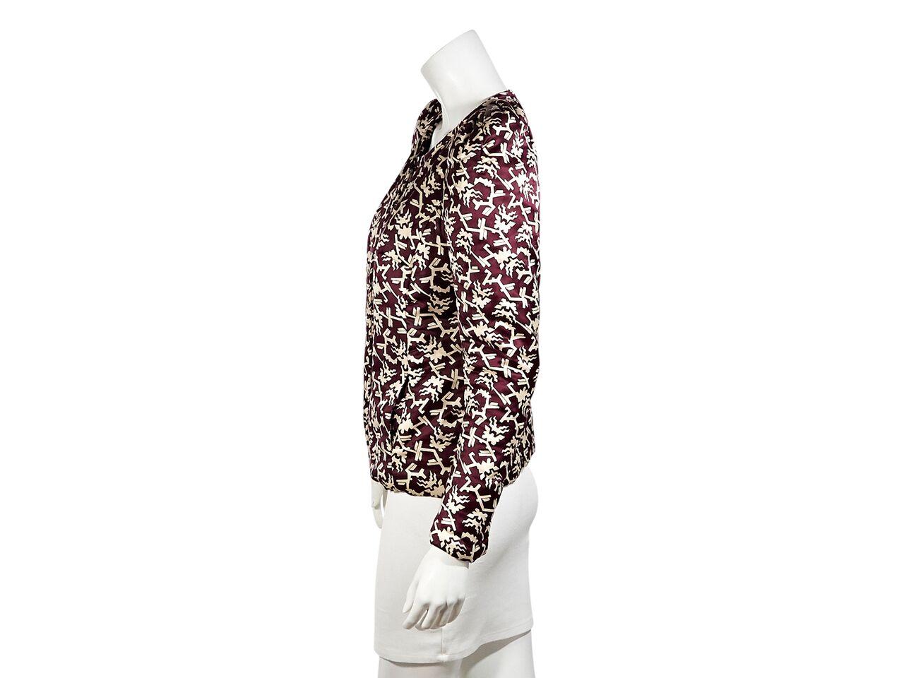 Product details:  Burgundy and cream printed cotton/silk jacket by Isabel Marant.  Roundneck.  Long sleeves.  Concealed hook and eye closure.  Waist slide pockets.  30