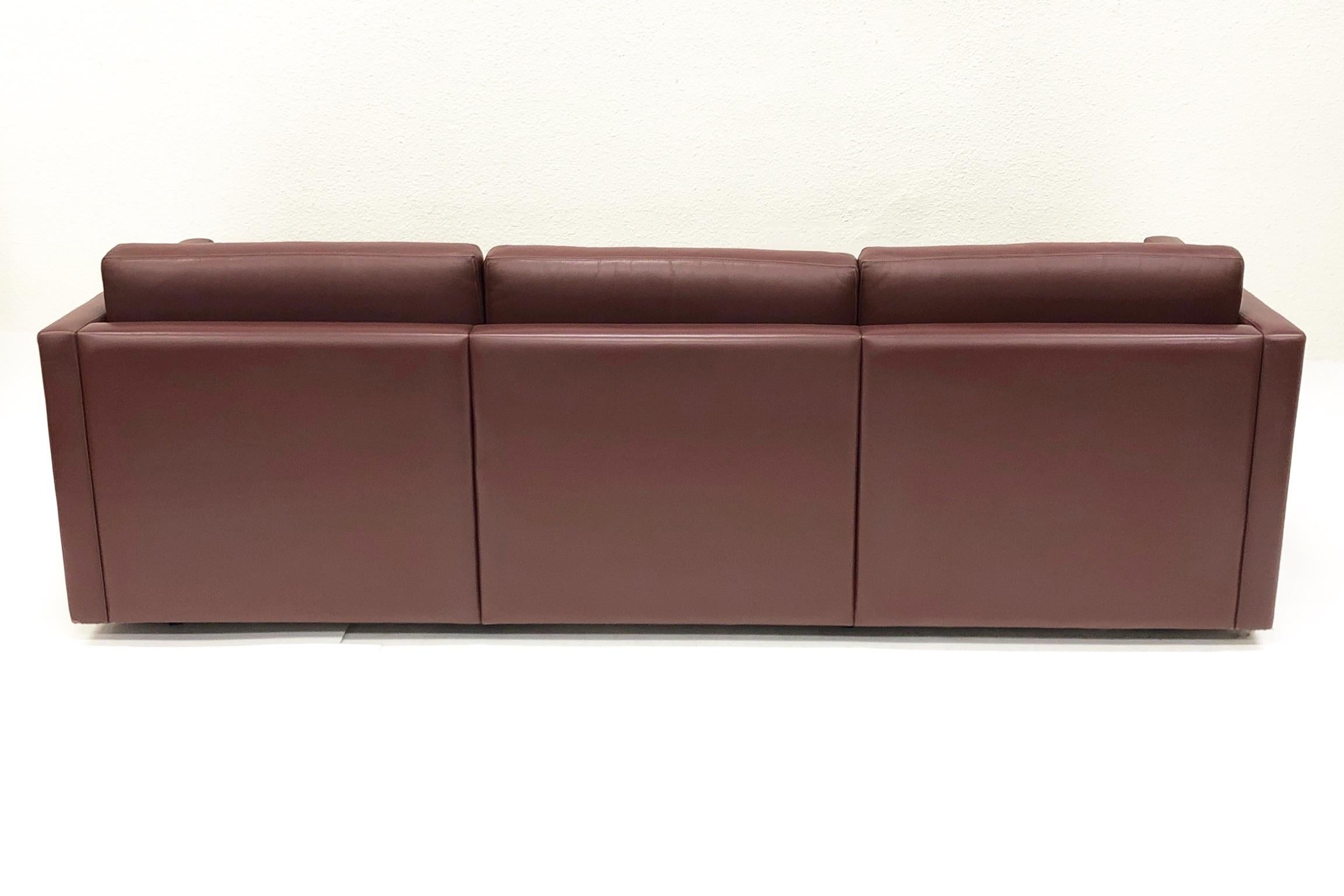 A original three-seat leather sofa design in 1971 by Charles Pfister for Knoll. The original burgundy color Knoll leather has been professionally cleaned and condition.
Overall dimensions: 86” wide, 33” deep, 29” high, 16” seat, 24” arm height.