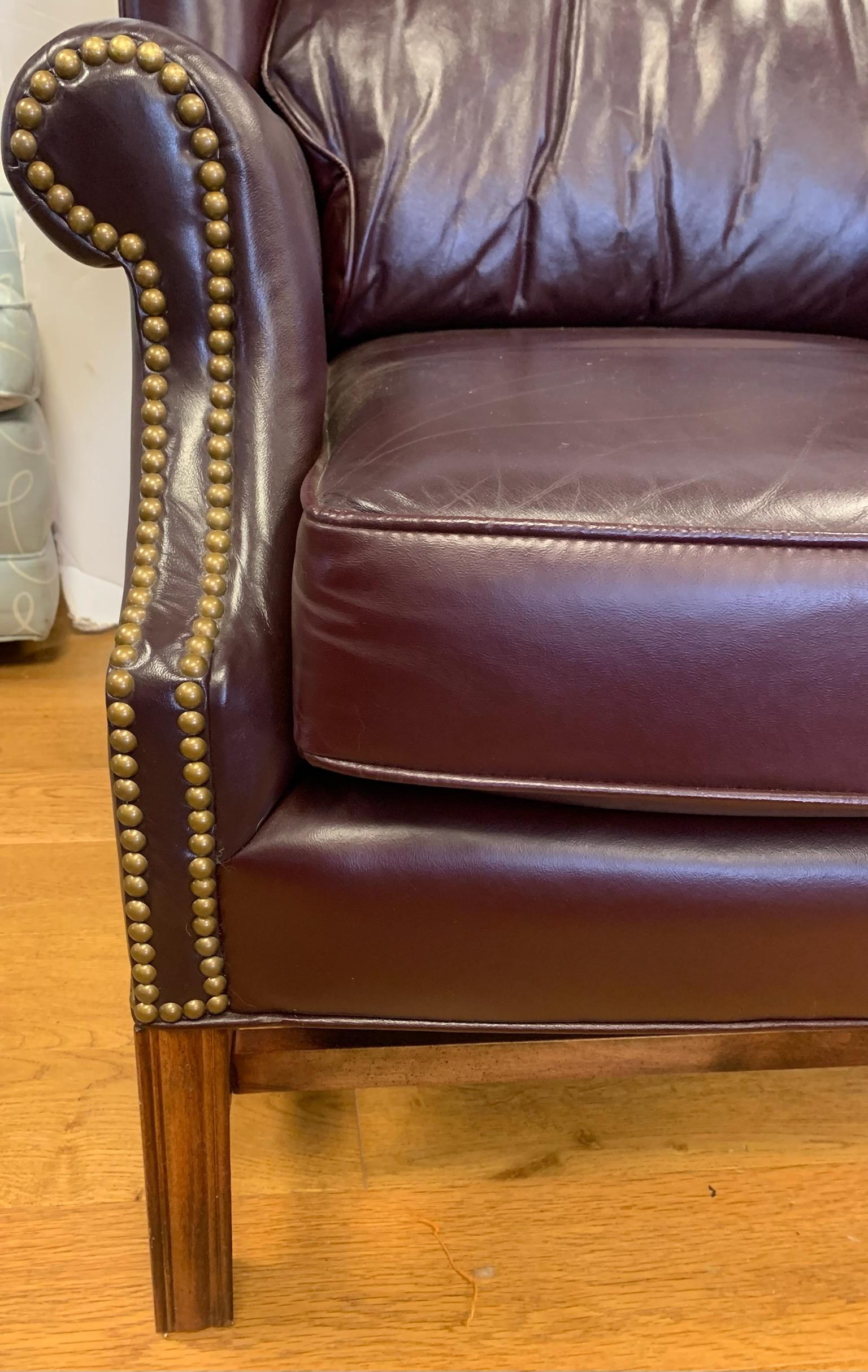 burgundy leather chair and ottoman