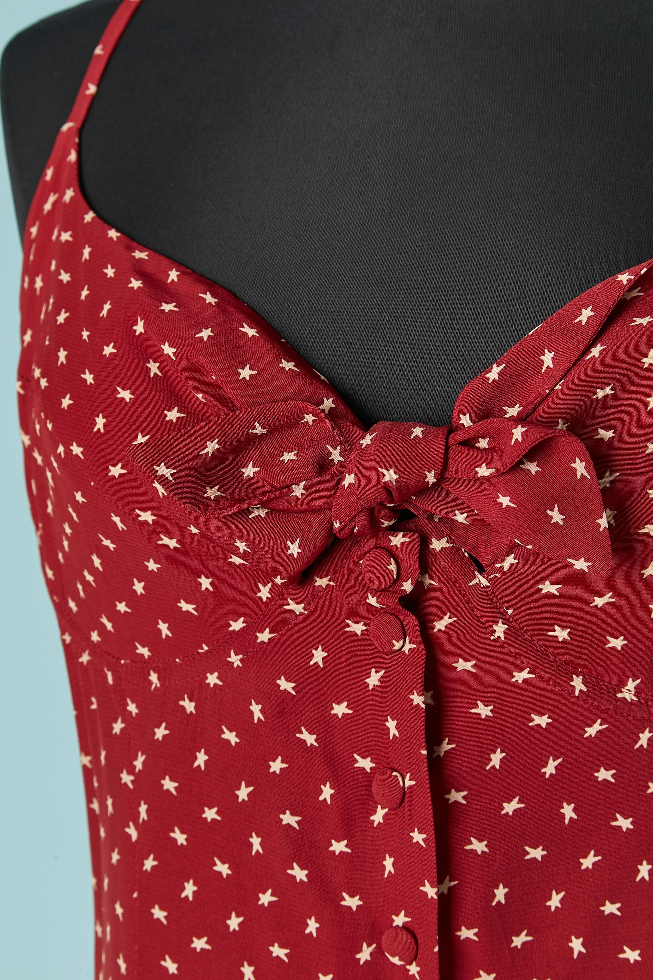 Burgundy long slip rayon dress with star print. Boned and under-wired bra. Snap closure ( looks like button covered in fabric) on the middle front. Bow to tied on the middle front. 
SIZE 38 (Fr) M 