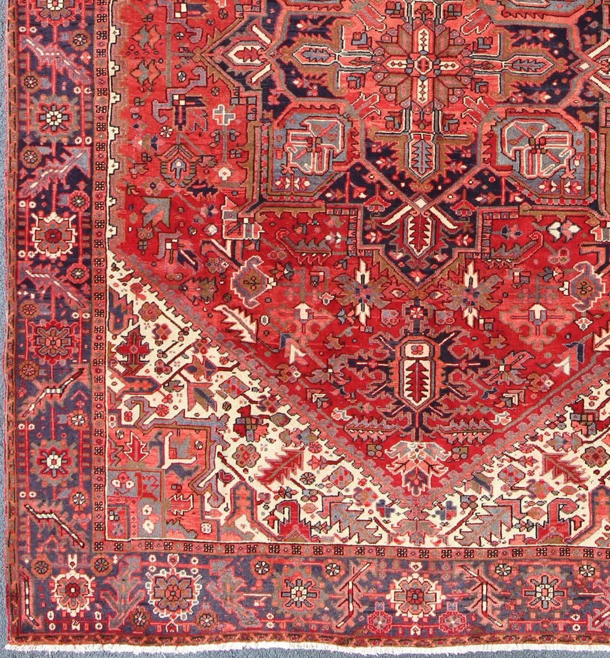 Burgundy midcentury Persian Heriz rug with stylized medallion design, rug h-610-11, country of origin / type: Iran / Heriz, circa 1950

This magnificent antique Persian Heriz carpet from the mid-20th century (circa 1950) bears an exquisite design