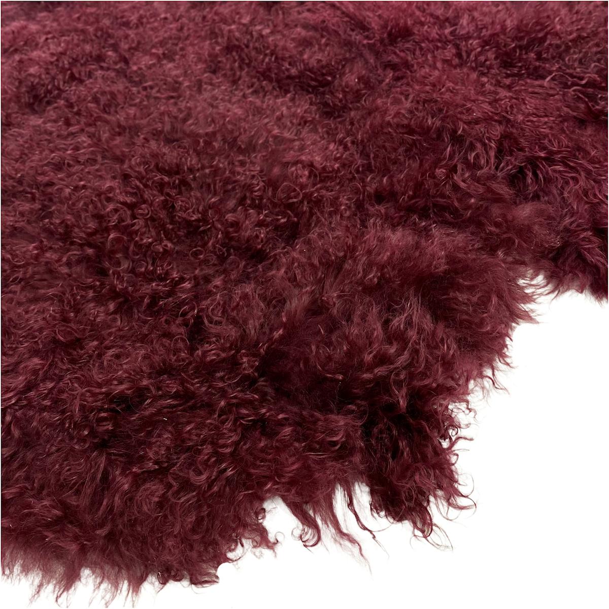 Enchanting and irresistible softness this burgundy red fur rug translates modern and stylish design paralleled with an expression of natural signature living. 

Featuring an eclectic wine color, enhancing the natural beauty of the Mongolian