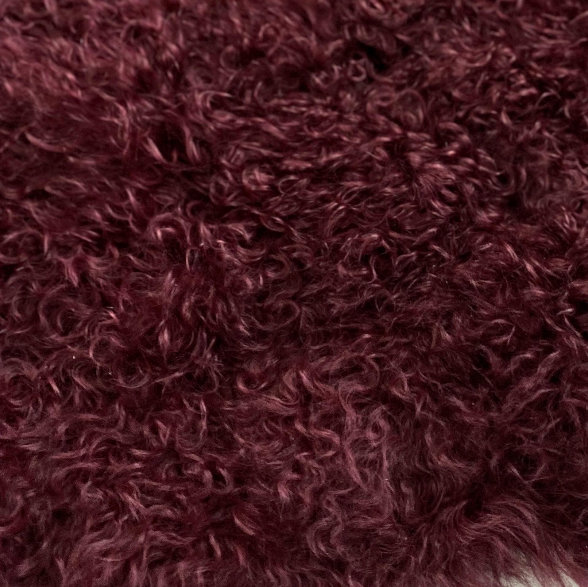 large red fur rug