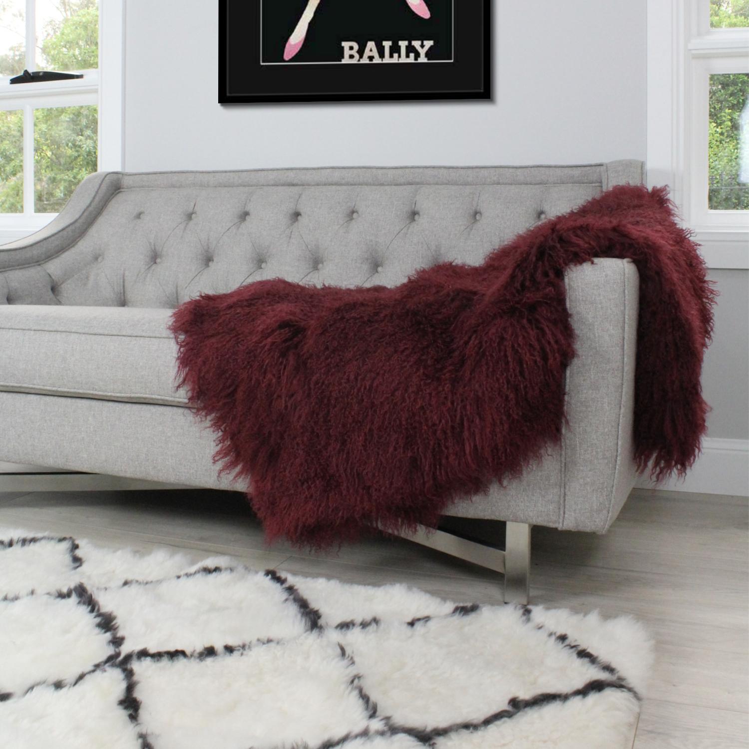 This super luxe burgundy red fur throw will add luxurious and inviting elements to your décor. Whether styling a chair, sofa or bed, the real fur throw blanket will instantly revamp a room into a designer interior as the curly / crimp fur like wool
