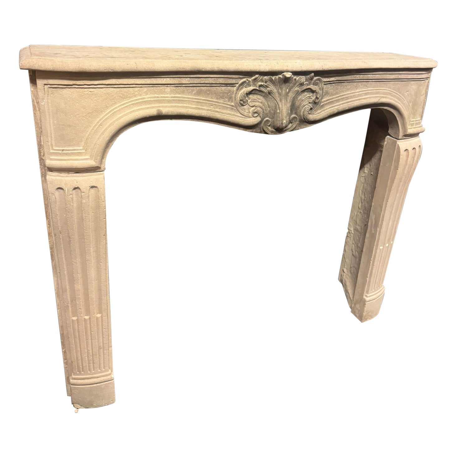 Burgundy stone mantle fireplace, with carved shell and wavy legs, France