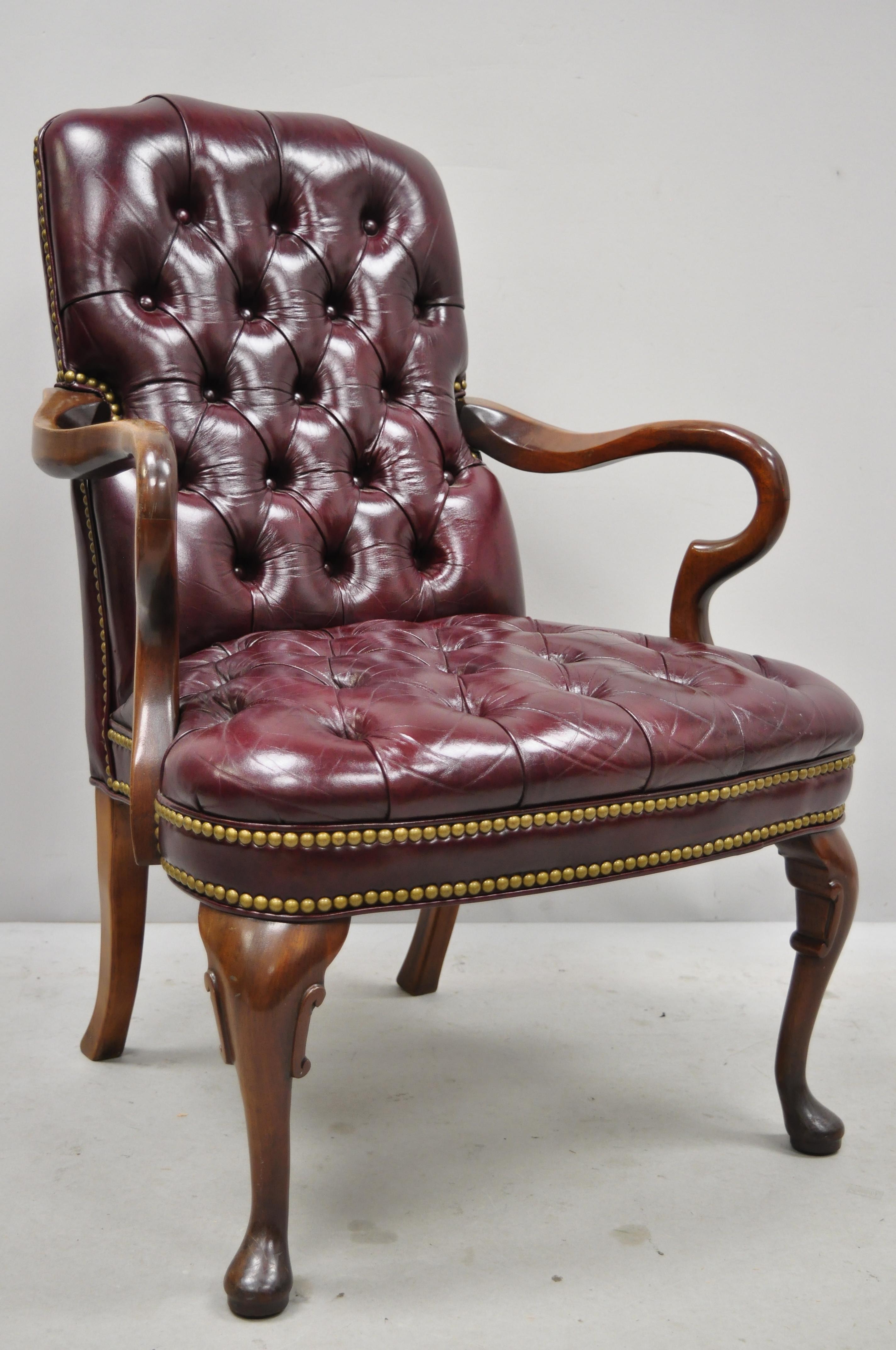 Burgundy tufted executive leather Gooseneck Queen Anne office library armchair. Item includes a solid wood frame, tufted leather upholstery, original label, shapely Queen Anne legs, quality American craftsmanship, circa mid-20th century.
