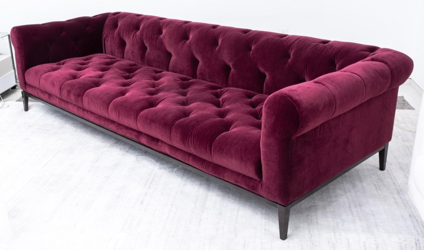Chesterfield burgundy velvet tufted sofa on a bronzed metal base. In good condition. Wear consistent with age and use.

Dimensions: 27