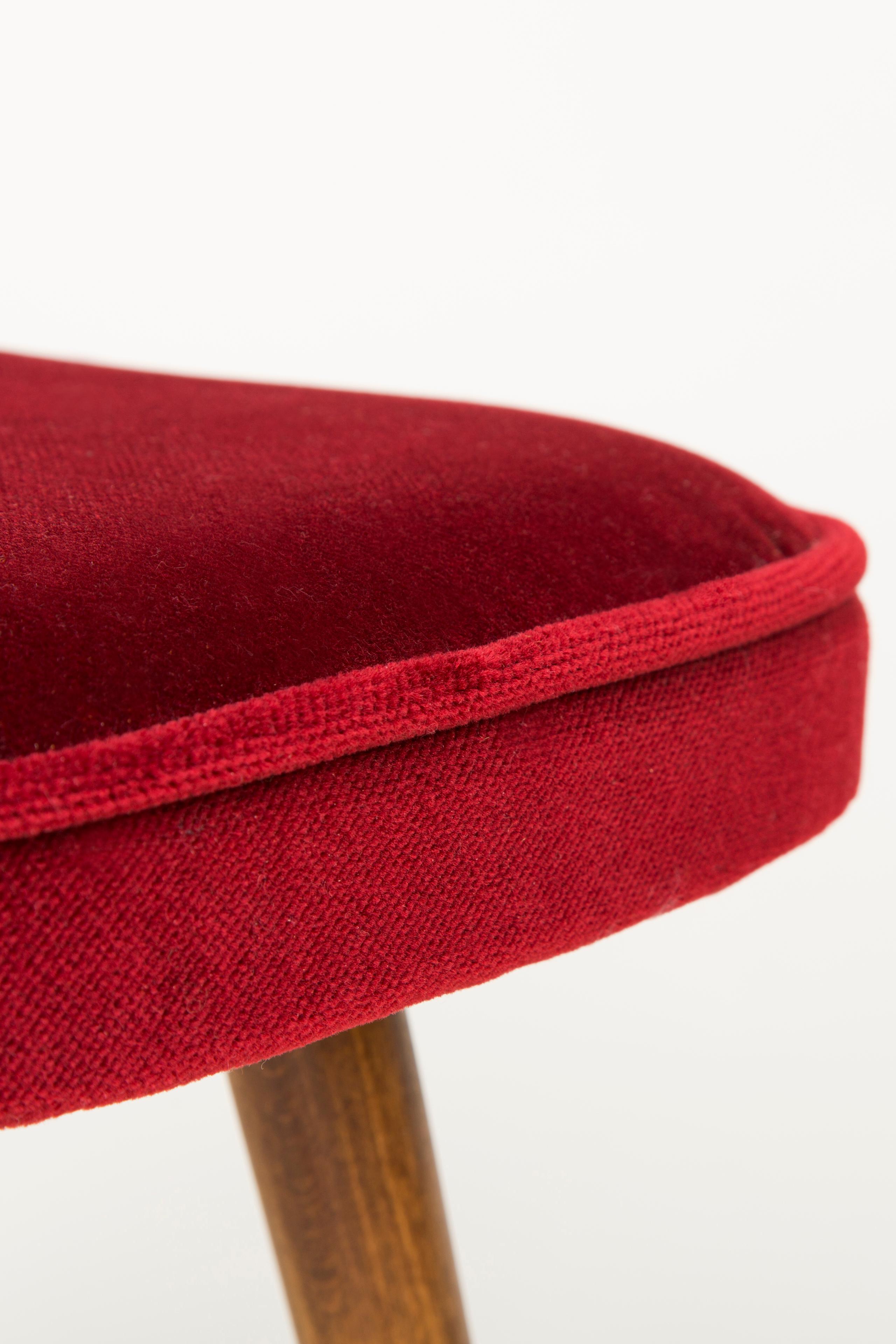 Stool from the turn of the 1960s and 1970s. Beautiful soft velvet burgundy upholstery. The stool consists of an upholstered part, a seat and wooden legs narrowing downwards, characteristic of the 1960s style. We can prepare this stool also in