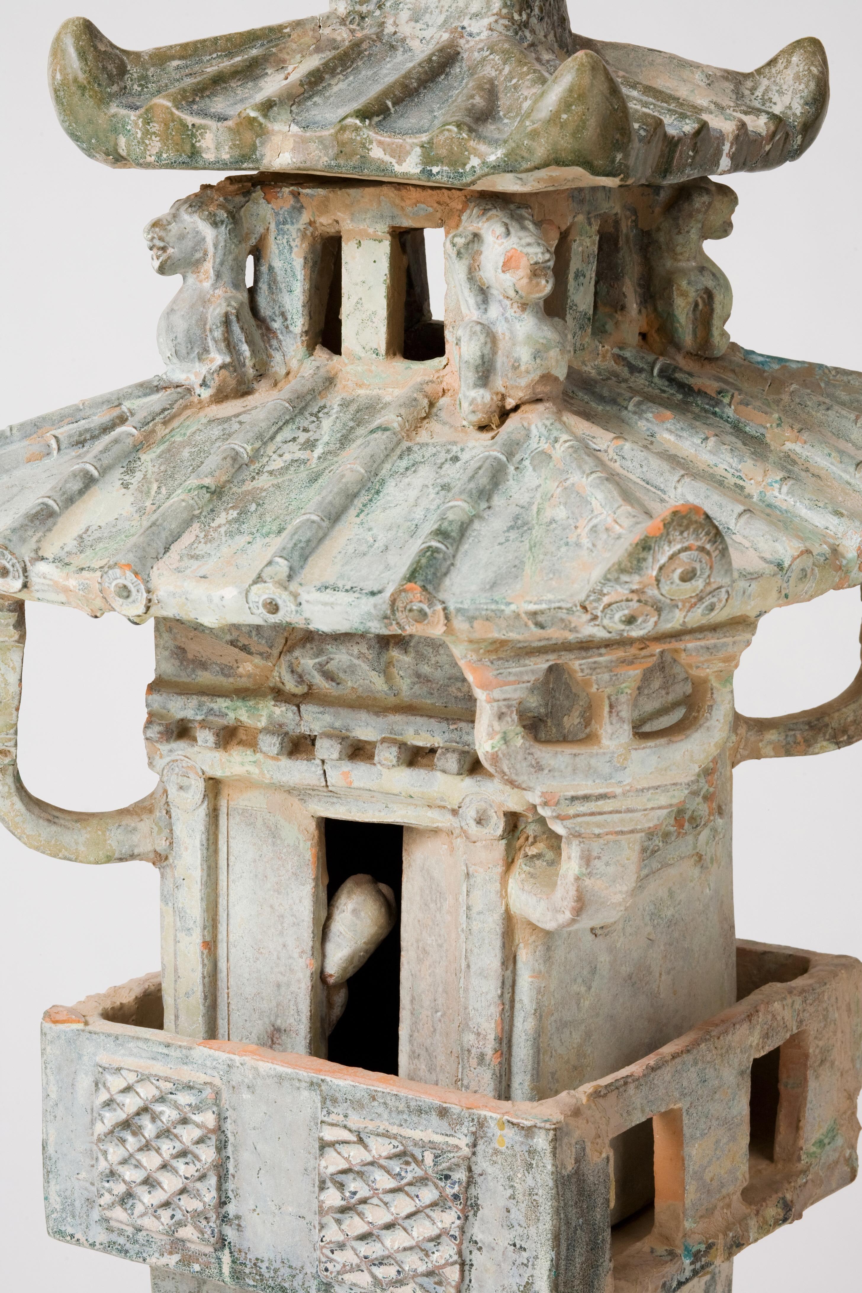 The tower consists of hollow removable floors, which stand in an stand and entrance above. Ceramic models of common structures were often placed in aristocratic tombs during the Han dynasty. Improved methods of construction in the Han period led to